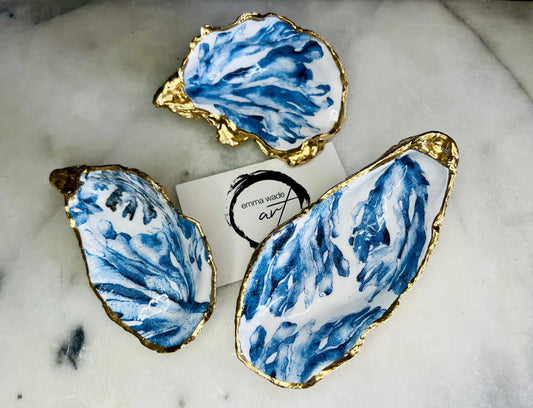 Trinket dishes gold finish, shell jewellery dish, navy and gold trinket tray, shell scallop dish, trinket tray shell, she dreams of the sea, shell jewellery bowl, golden trinket dish, oyster shell blue seaweed, blue and gold dishes, decoupaged earring dish, oyster dish with coral, shell art trinket, decoupage shell dish, Emma Wade art, bride oyster dish, oyster shell trinket, shell key bowl, shell coral dish