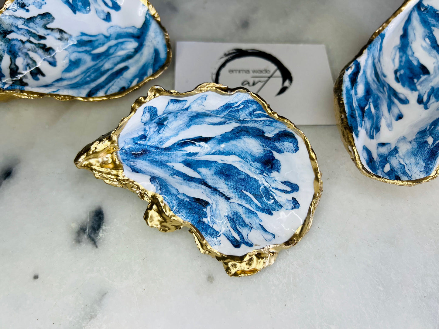 Trinket dishes gold finish, shell jewellery dish, navy and gold trinket tray, shell scallop dish, trinket tray shell, she dreams of the sea, shell jewellery bowl, golden trinket dish, oyster shell blue seaweed, blue and gold dishes, decoupaged earring dish, oyster dish with coral, shell art trinket, decoupage shell dish, Emma Wade art, bride oyster dish, oyster shell trinket, shell key bowl, shell coral dish