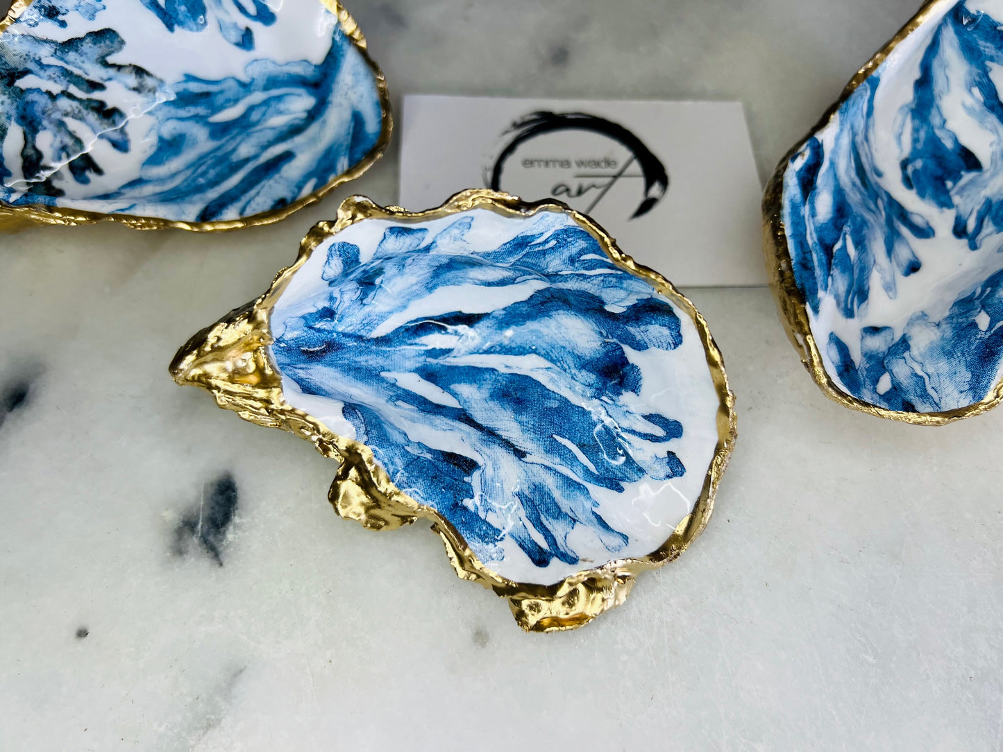 Trinket dishes gold finish, shell jewellery dish, navy and gold trinket tray, shell scallop dish, trinket tray shell, she dreams of the sea, shell jewellery bowl, golden trinket dish, oyster shell blue seaweed, blue and gold dishes, decoupaged earring dish, oyster dish with coral, shell art trinket, decoupage shell dish, Emma Wade art, bride oyster dish, oyster shell trinket, shell key bowl, shell coral dish