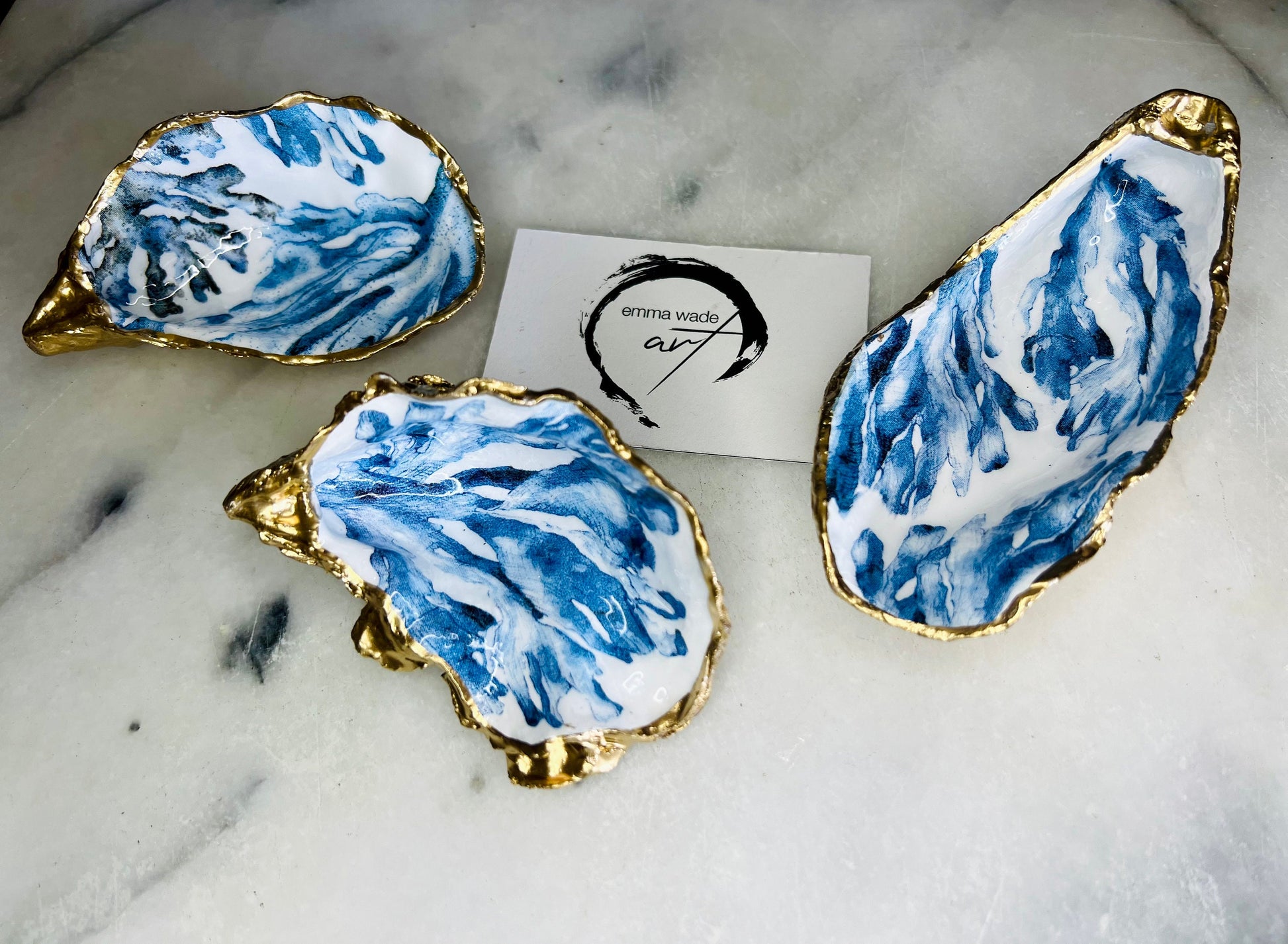 Trinket dishes gold finish, shell jewellery dish, navy and gold trinket tray, shell scallop dish, trinket tray shell, she dreams of the sea, shell jewellery bowl, golden trinket dish, oyster shell blue seaweed, blue and gold dishes, decoupaged earring dish, oyster dish with coral, shell art trinket, decoupage shell dish, Emma Wade art, bride oyster dish, oyster shell trinket, shell key bowl, shell coral dish