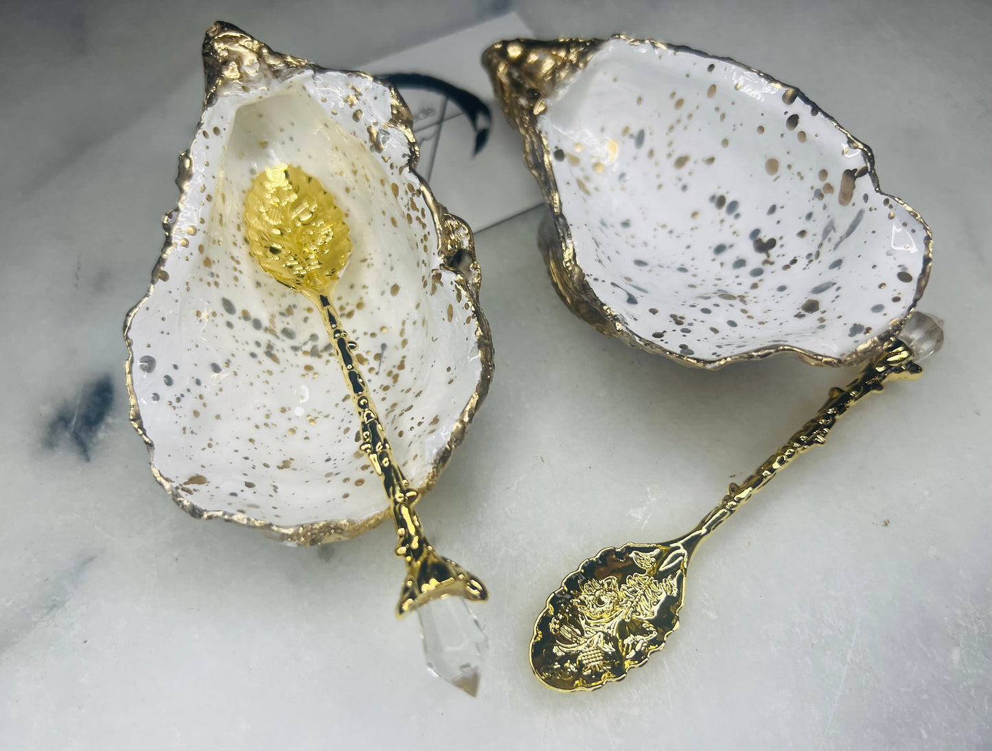 gift for her, dining decor, handmade dish, shell ornament, salt dish, salt and pepper pots, spice pots, coastal gifts, home decor, wedding favours, bridesmaid gift, pearl anniversary, shell decor, decorative accessories, EmmaWadeART, coastal decor, Handmade Dorset oyster shell salt and pepper pinch pots with glossy white interiors, speckled with liquid gold and silver leaf finish. Perfect coastal kitchen decor, beach wedding favours, or unique gift for foodies and hosts.