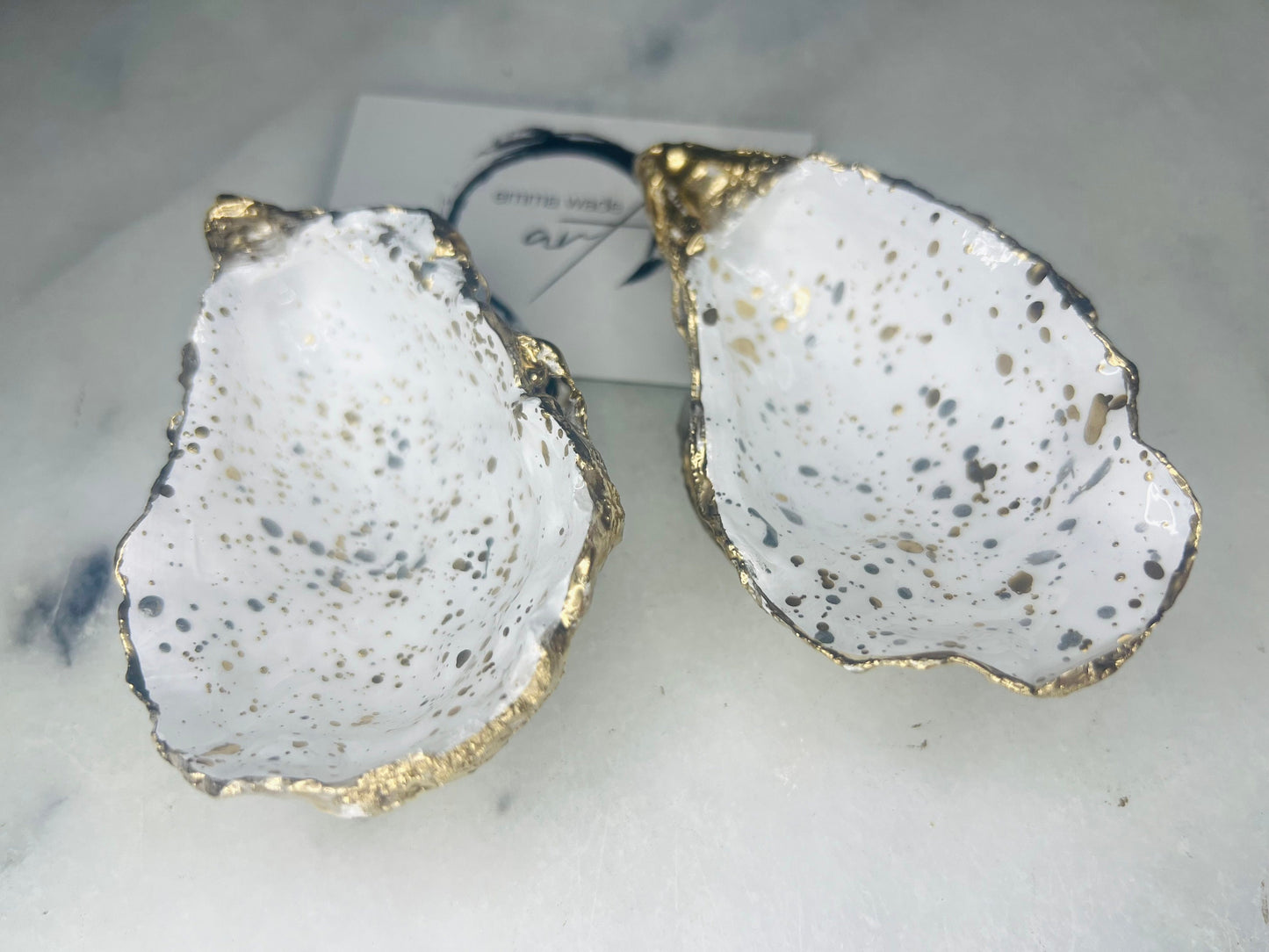 gift for her, dining decor, handmade dish, shell ornament, salt dish, salt and pepper pots, spice pots, coastal gifts, home decor, wedding favours, bridesmaid gift, pearl anniversary, shell decor, decorative accessories, EmmaWadeART, coastal decor, Handmade Dorset oyster shell salt and pepper pinch pots with glossy white interiors, speckled with liquid gold and silver leaf finish. Perfect coastal kitchen decor, beach wedding favours, or unique gift for foodies and hosts.