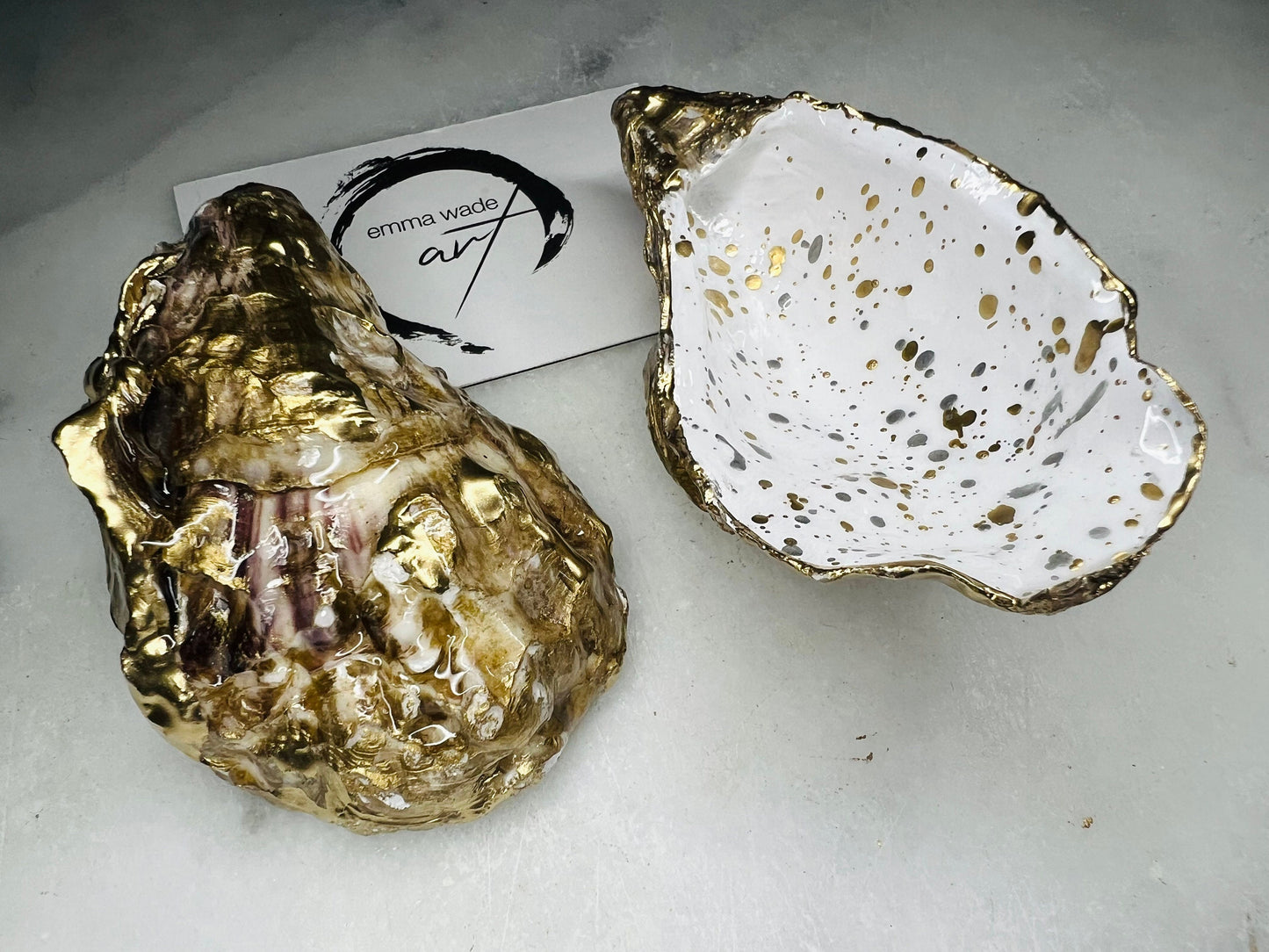 gift for her, dining decor, handmade dish, shell ornament, salt dish, salt and pepper pots, spice pots, coastal gifts, home decor, wedding favours, bridesmaid gift, pearl anniversary, shell decor, decorative accessories, EmmaWadeART, coastal decor, Handmade Dorset oyster shell salt and pepper pinch pots with glossy white interiors, speckled with liquid gold and silver leaf finish. Perfect coastal kitchen decor, beach wedding favours, or unique gift for foodies and hosts.