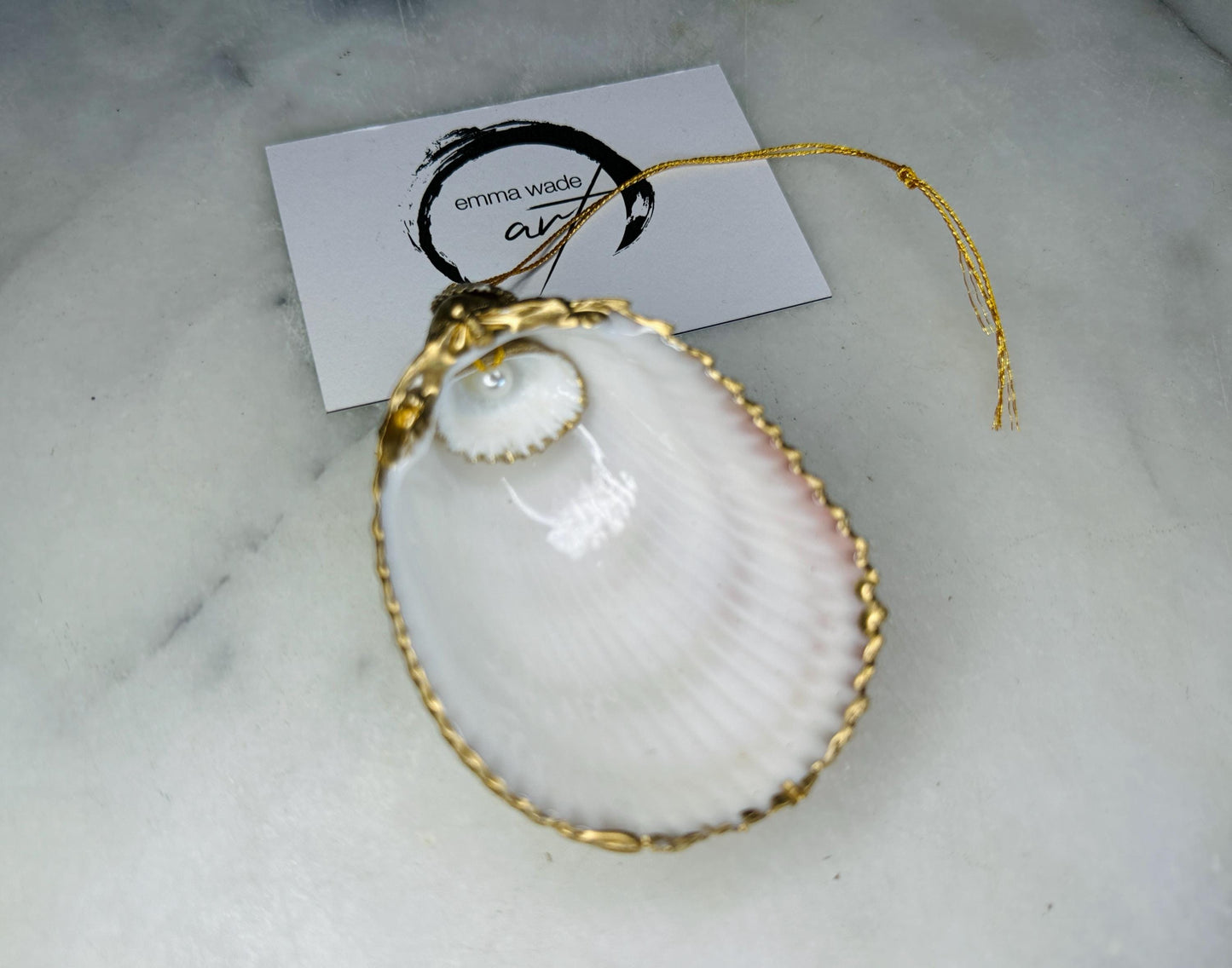 gloss finish cockle shell ornament, Swarovski pearl cockle shell decoration, gold leaf gilded shell hanging ornament, coastal Christmas tree decoration, handmade Dorset cockle shell ornament, oyster and cockle shell jewellery trinket dish, pearl anniversary shell gift, coastal home décor ornament, gilded shell Christmas bauble, handmade coastal wedding gift, UK artisan seashell decoration, sustainable seashell ornament, gold gilded cockle shell keepsake, coastal pearl ornament UK