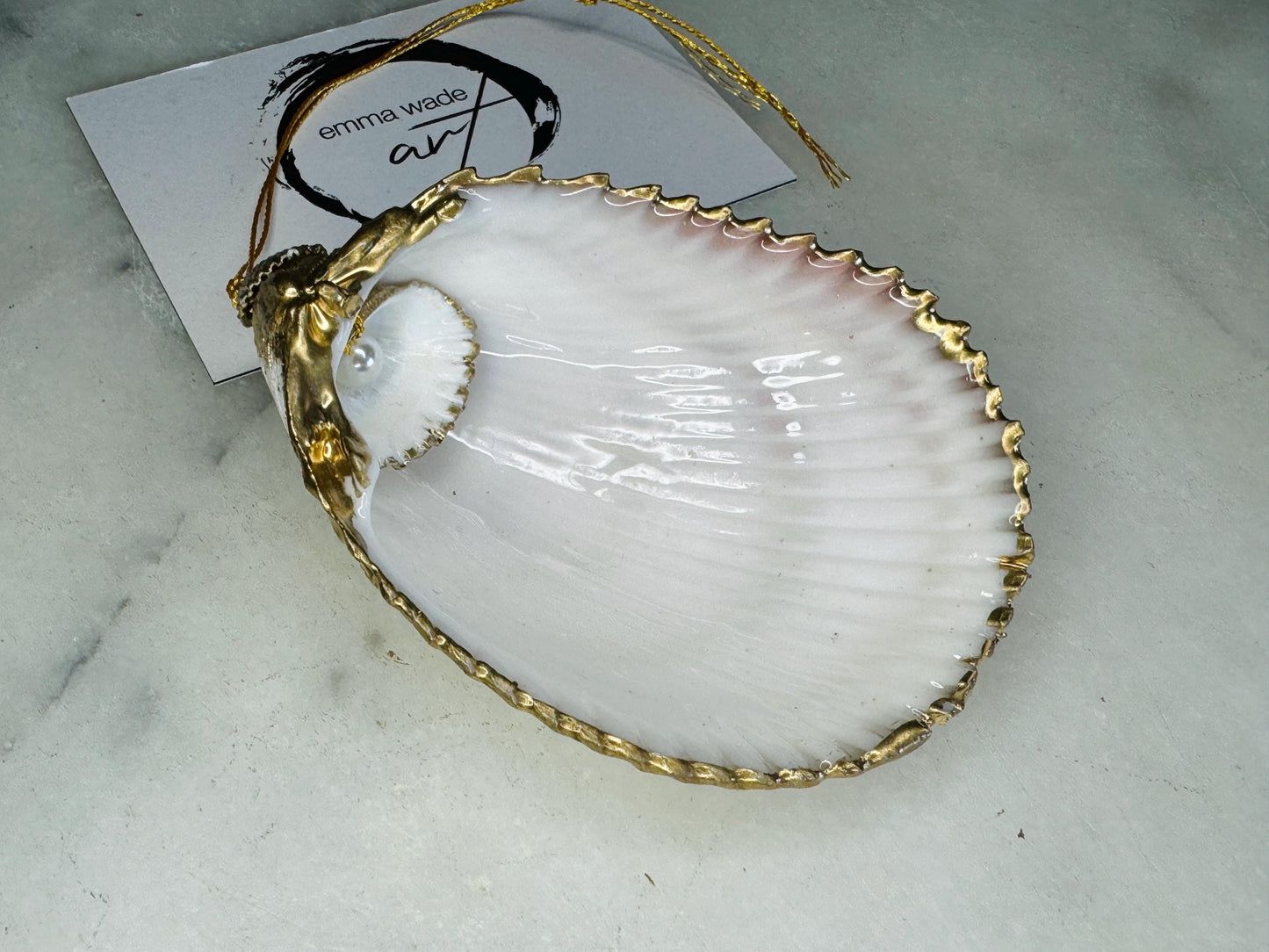 gloss finish cockle shell ornament, Swarovski pearl cockle shell decoration, gold leaf gilded shell hanging ornament, coastal Christmas tree decoration, handmade Dorset cockle shell ornament, oyster and cockle shell jewellery trinket dish, pearl anniversary shell gift, coastal home décor ornament, gilded shell Christmas bauble, handmade coastal wedding gift, UK artisan seashell decoration, sustainable seashell ornament, gold gilded cockle shell keepsake, coastal pearl ornament UK