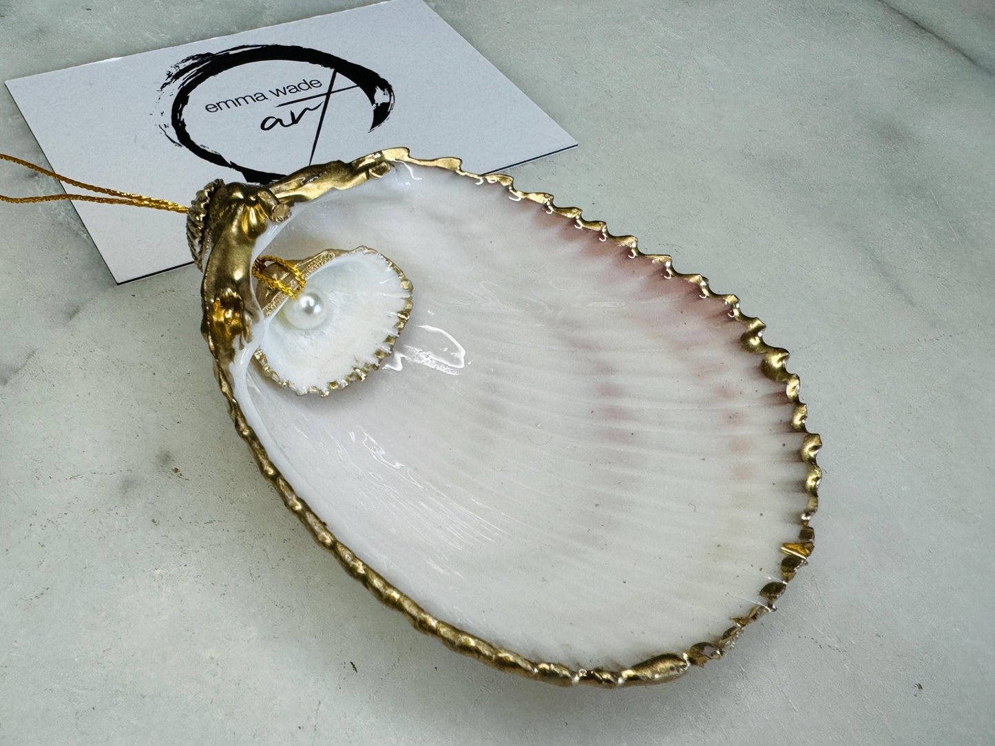 gloss finish cockle shell ornament, Swarovski pearl cockle shell decoration, gold leaf gilded shell hanging ornament, coastal Christmas tree decoration, handmade Dorset cockle shell ornament, oyster and cockle shell jewellery trinket dish, pearl anniversary shell gift, coastal home décor ornament, gilded shell Christmas bauble, handmade coastal wedding gift, UK artisan seashell decoration, sustainable seashell ornament, gold gilded cockle shell keepsake, coastal pearl ornament UK