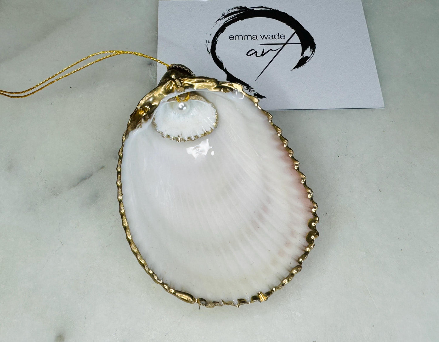 gloss finish cockle shell ornament, Swarovski pearl cockle shell decoration, gold leaf gilded shell hanging ornament, coastal Christmas tree decoration, handmade Dorset cockle shell ornament, oyster and cockle shell jewellery trinket dish, pearl anniversary shell gift, coastal home décor ornament, gilded shell Christmas bauble, handmade coastal wedding gift, UK artisan seashell decoration, sustainable seashell ornament, gold gilded cockle shell keepsake, coastal pearl ornament UK