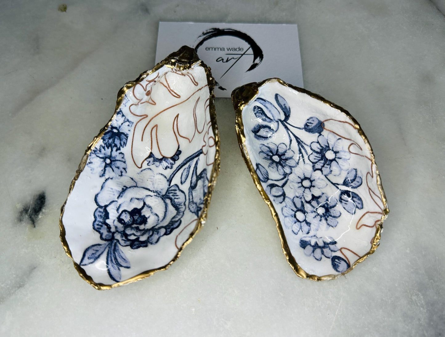 blue white Palmers print oyster shell dish, Dorset oyster shell trinket dish, gold leaf gilded oyster shell jewellery holder, handmade coastal oyster shell decor, sustainable oyster shell ornament, oyster shell bathroom tray, oyster shell salt and pepper pinch pot, oyster shell sugar dish, oyster shell spoon rest, floral oyster shell wedding gift, oyster shell Christmas present, eco friendly oyster shell art, oyster shell keepsake, unique handmade oyster shell gift UK