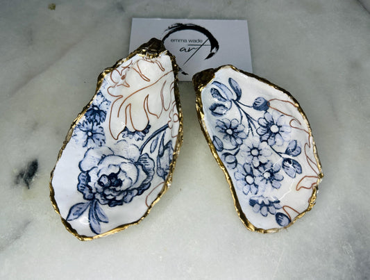 blue white Palmers print oyster shell dish, Dorset oyster shell trinket dish, gold leaf gilded oyster shell jewellery holder, handmade coastal oyster shell decor, sustainable oyster shell ornament, oyster shell bathroom tray, oyster shell salt and pepper pinch pot, oyster shell sugar dish, oyster shell spoon rest, floral oyster shell wedding gift, oyster shell Christmas present, eco friendly oyster shell art, oyster shell keepsake, unique handmade oyster shell gift UK