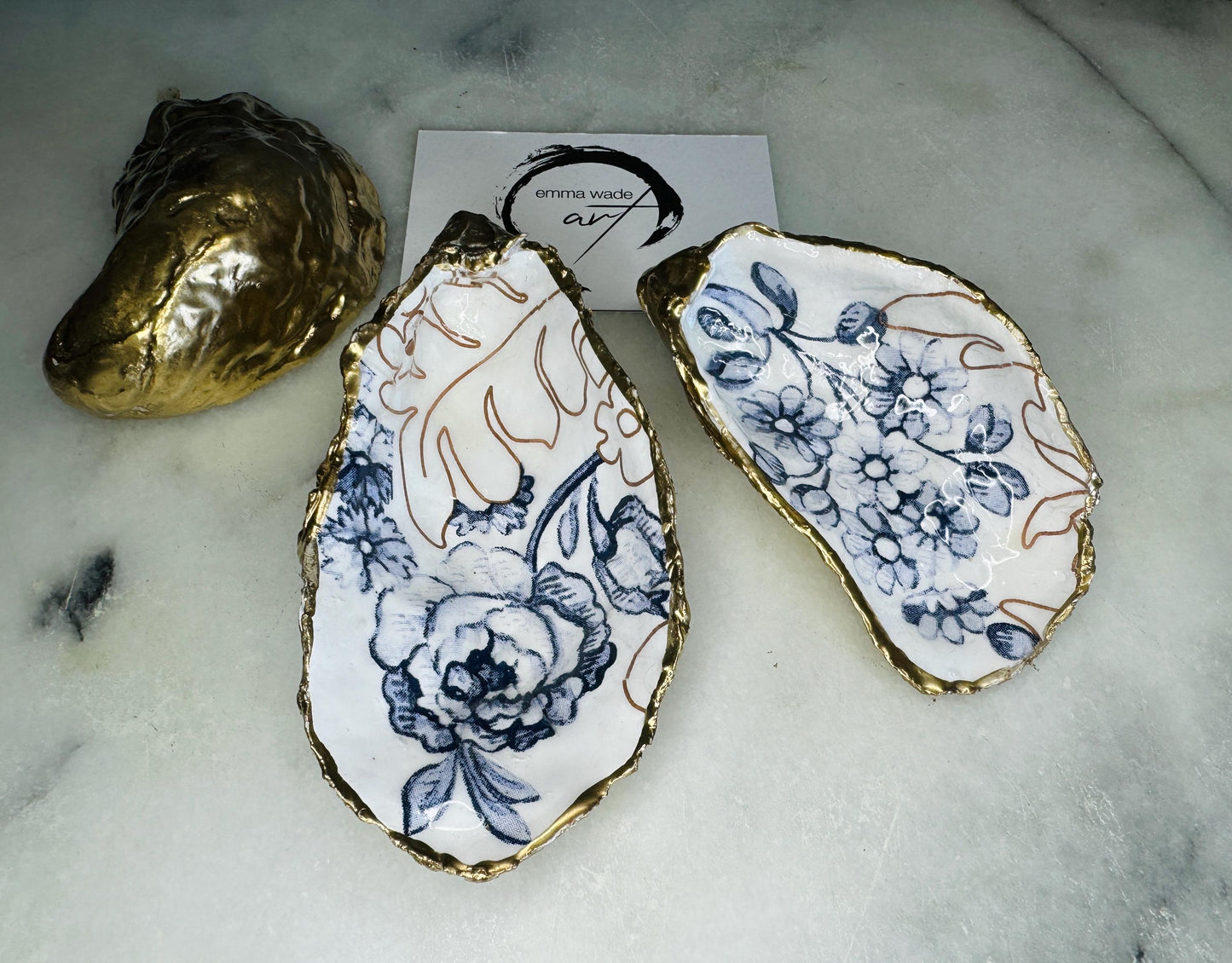 blue white Palmers print oyster shell dish, Dorset oyster shell trinket dish, gold leaf gilded oyster shell jewellery holder, handmade coastal oyster shell decor, sustainable oyster shell ornament, oyster shell bathroom tray, oyster shell salt and pepper pinch pot, oyster shell sugar dish, oyster shell spoon rest, floral oyster shell wedding gift, oyster shell Christmas present, eco friendly oyster shell art, oyster shell keepsake, unique handmade oyster shell gift UK