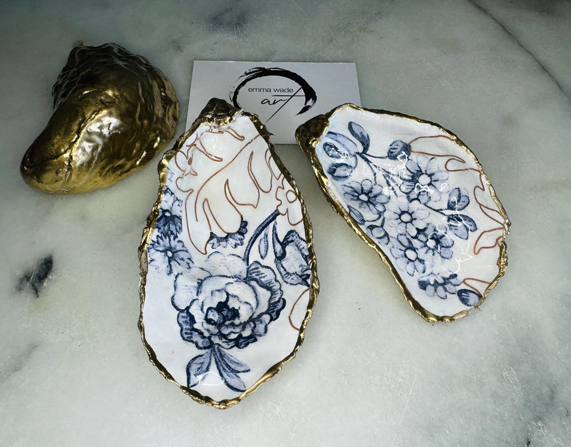 blue white Palmers print oyster shell dish, Dorset oyster shell trinket dish, gold leaf gilded oyster shell jewellery holder, handmade coastal oyster shell decor, sustainable oyster shell ornament, oyster shell bathroom tray, oyster shell salt and pepper pinch pot, oyster shell sugar dish, oyster shell spoon rest, floral oyster shell wedding gift, oyster shell Christmas present, eco friendly oyster shell art, oyster shell keepsake, unique handmade oyster shell gift UK