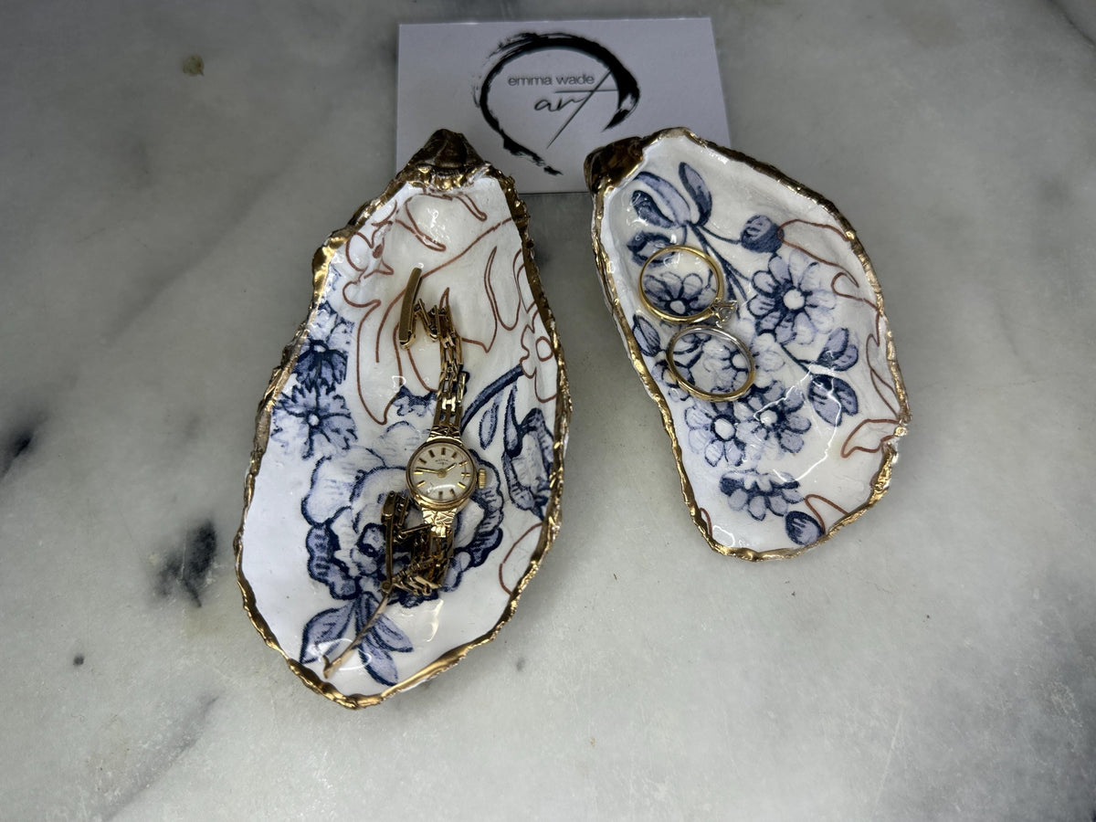 blue white Palmers print oyster shell dish, Dorset oyster shell trinket dish, gold leaf gilded oyster shell jewellery holder, handmade coastal oyster shell decor, sustainable oyster shell ornament, oyster shell bathroom tray, oyster shell salt and pepper pinch pot, oyster shell sugar dish, oyster shell spoon rest, floral oyster shell wedding gift, oyster shell Christmas present, eco friendly oyster shell art, oyster shell keepsake, unique handmade oyster shell gift UK