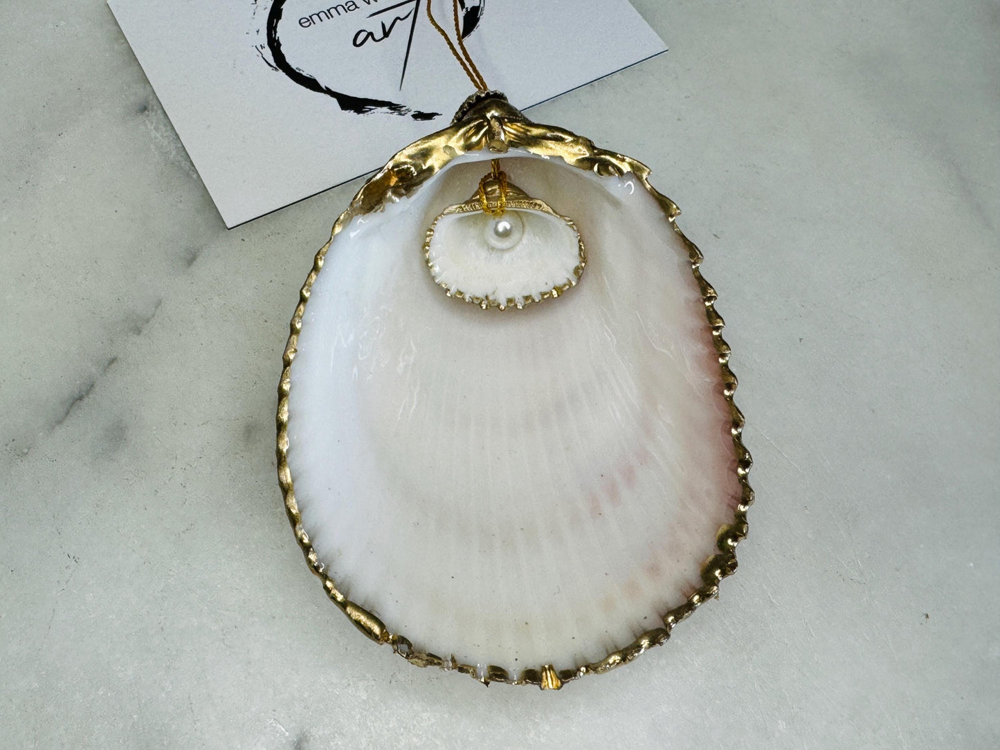 gloss finish cockle shell ornament, Swarovski pearl cockle shell decoration, gold leaf gilded shell hanging ornament, coastal Christmas tree decoration, handmade Dorset cockle shell ornament, oyster and cockle shell jewellery trinket dish, pearl anniversary shell gift, coastal home décor ornament, gilded shell Christmas bauble, handmade coastal wedding gift, UK artisan seashell decoration, sustainable seashell ornament, gold gilded cockle shell keepsake, coastal pearl ornament UK