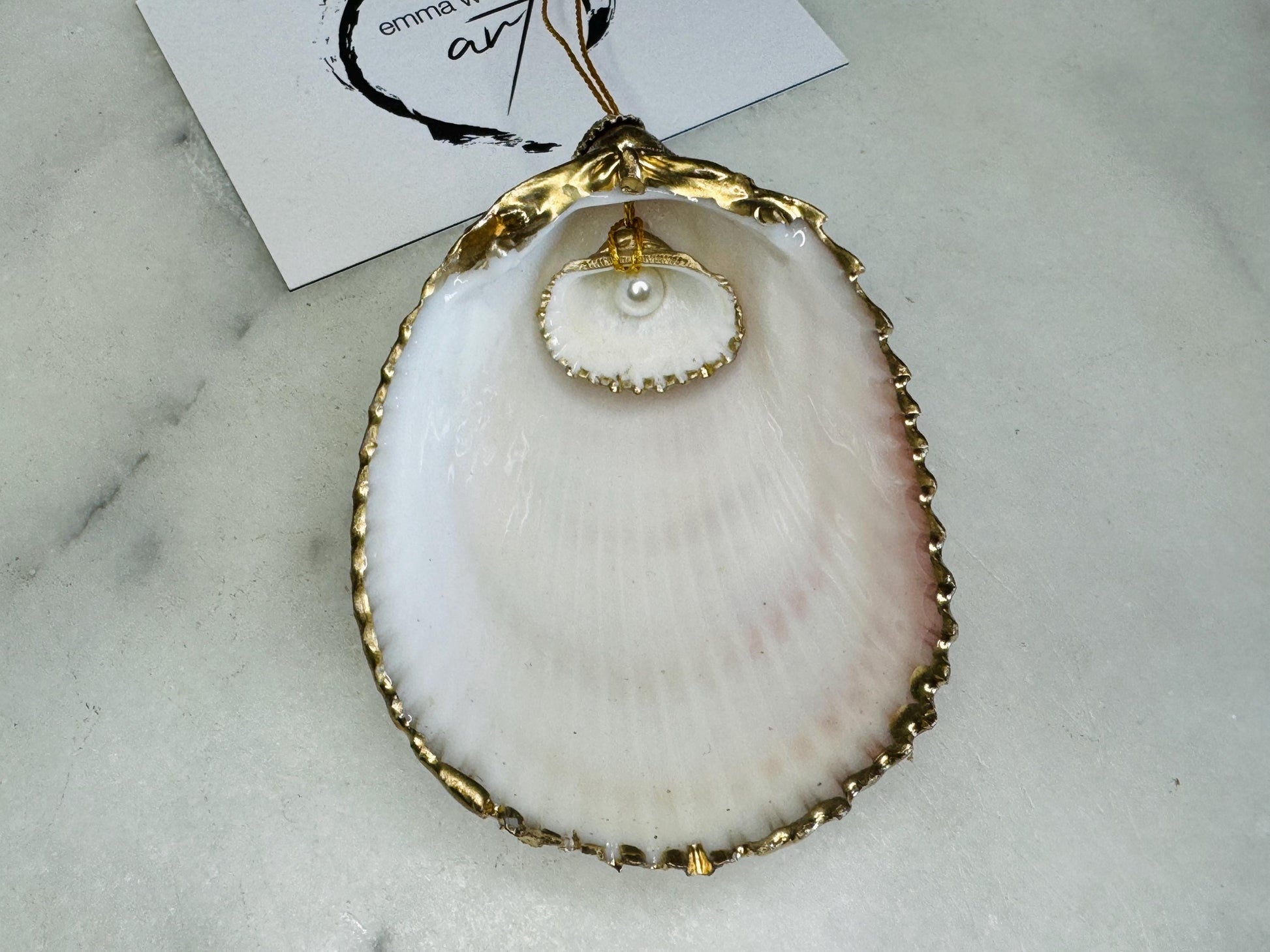 gloss finish cockle shell ornament, Swarovski pearl cockle shell decoration, gold leaf gilded shell hanging ornament, coastal Christmas tree decoration, handmade Dorset cockle shell ornament, oyster and cockle shell jewellery trinket dish, pearl anniversary shell gift, coastal home décor ornament, gilded shell Christmas bauble, handmade coastal wedding gift, UK artisan seashell decoration, sustainable seashell ornament, gold gilded cockle shell keepsake, coastal pearl ornament UK