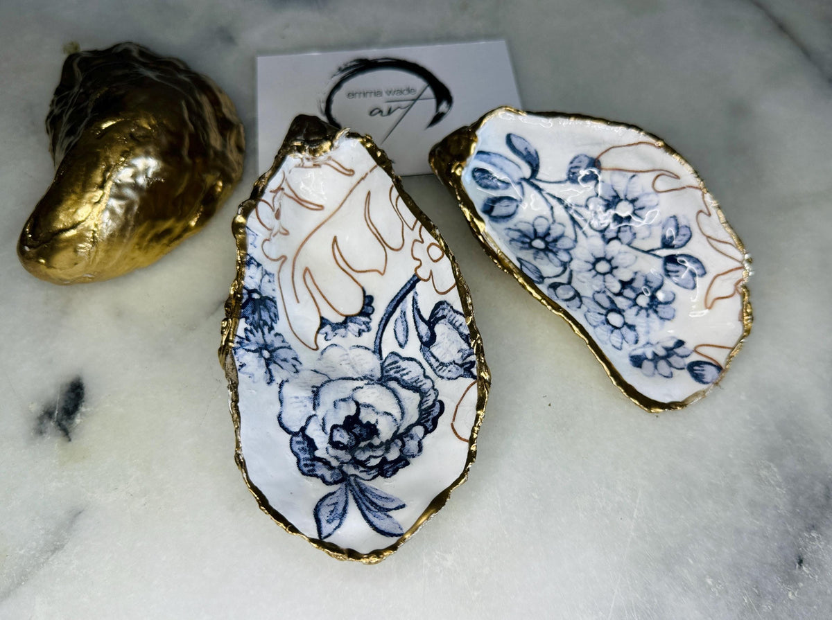 blue white Palmers print oyster shell dish, Dorset oyster shell trinket dish, gold leaf gilded oyster shell jewellery holder, handmade coastal oyster shell decor, sustainable oyster shell ornament, oyster shell bathroom tray, oyster shell salt and pepper pinch pot, oyster shell sugar dish, oyster shell spoon rest, floral oyster shell wedding gift, oyster shell Christmas present, eco friendly oyster shell art, oyster shell keepsake, unique handmade oyster shell gift UK