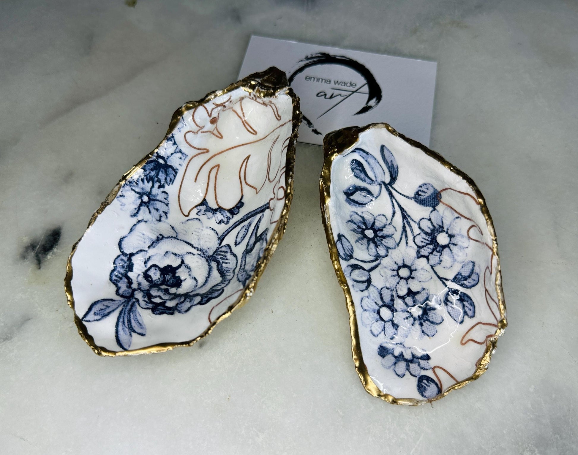 blue white Palmers print oyster shell dish, Dorset oyster shell trinket dish, gold leaf gilded oyster shell jewellery holder, handmade coastal oyster shell decor, sustainable oyster shell ornament, oyster shell bathroom tray, oyster shell salt and pepper pinch pot, oyster shell sugar dish, oyster shell spoon rest, floral oyster shell wedding gift, oyster shell Christmas present, eco friendly oyster shell art, oyster shell keepsake, unique handmade oyster shell gift UK