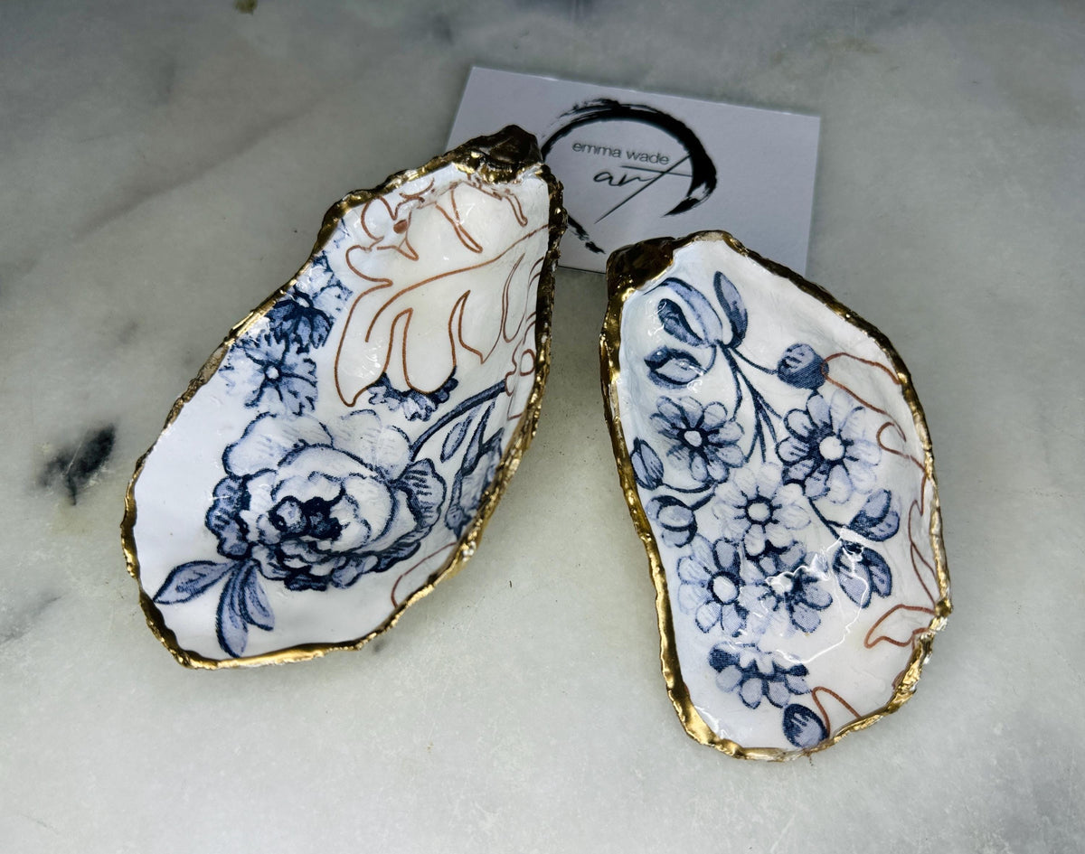 blue white Palmers print oyster shell dish, Dorset oyster shell trinket dish, gold leaf gilded oyster shell jewellery holder, handmade coastal oyster shell decor, sustainable oyster shell ornament, oyster shell bathroom tray, oyster shell salt and pepper pinch pot, oyster shell sugar dish, oyster shell spoon rest, floral oyster shell wedding gift, oyster shell Christmas present, eco friendly oyster shell art, oyster shell keepsake, unique handmade oyster shell gift UK