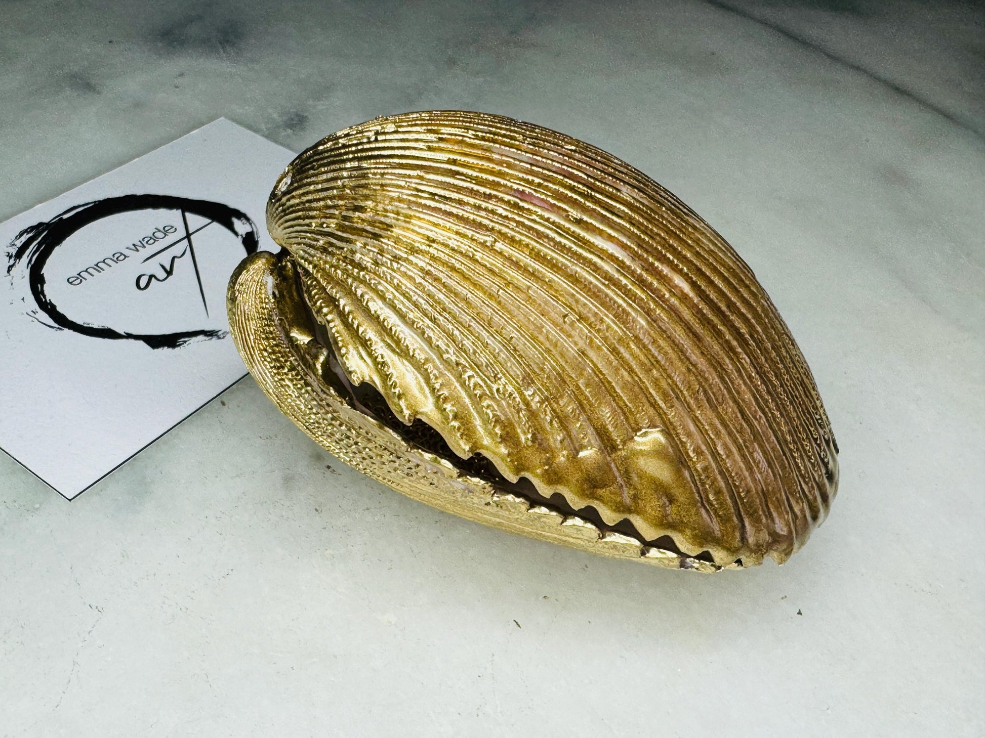 Handmade gold gilded cockle shell jewellery box with pearly white interior and optional freshwater pearl necklace. Coastal shell ring box crafted from natural Dorset shells, edged with liquid gold leaf and presented in a luxury gift box. Elegant seaside-inspired keepsake gift for weddings, bridesmaids, birthdays, anniversaries, or jewellery storage.