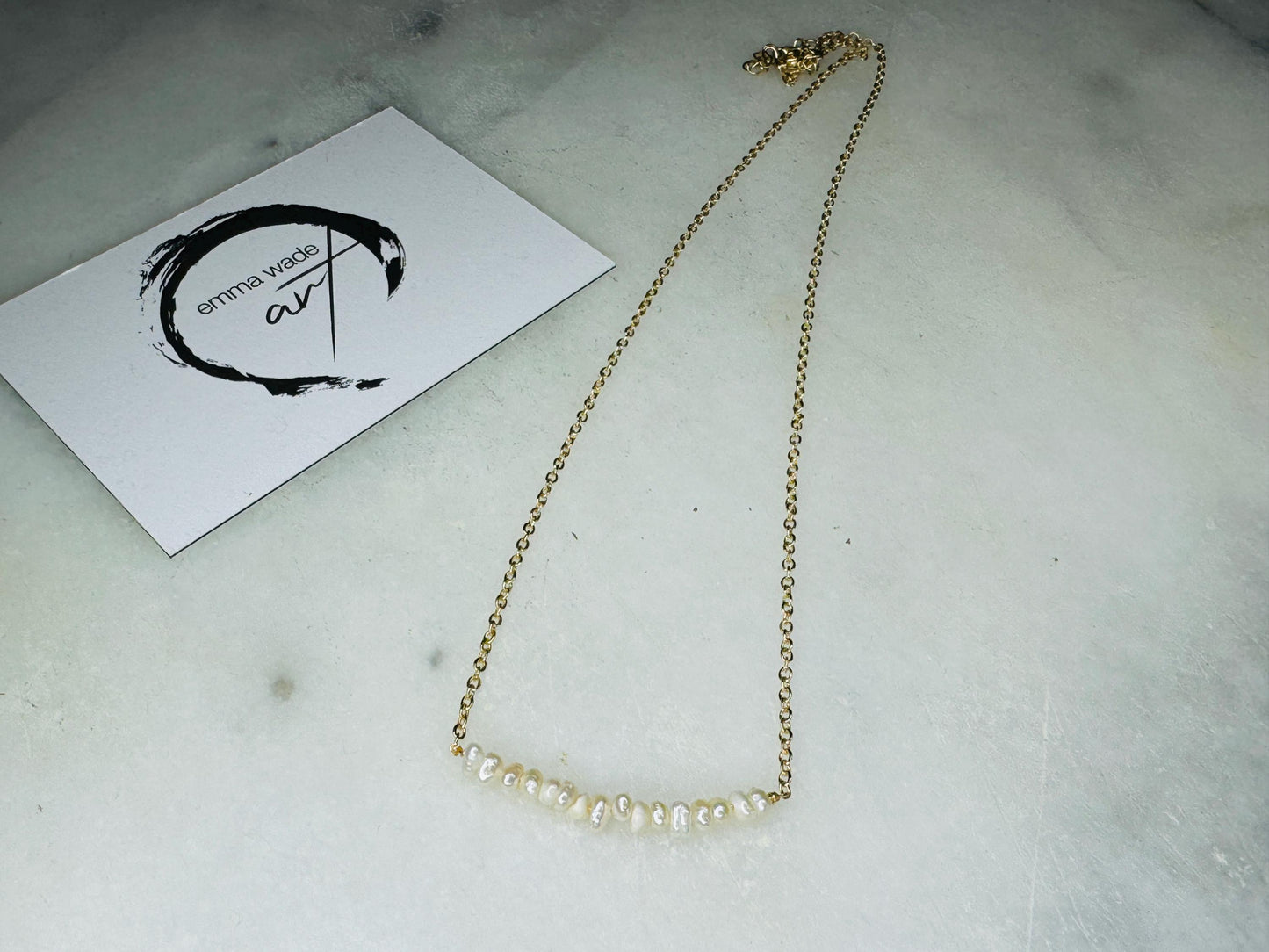 Handmade gold gilded cockle shell jewellery box with pearly white interior and optional freshwater pearl necklace. Coastal shell ring box crafted from natural Dorset shells, edged with liquid gold leaf and presented in a luxury gift box. Elegant seaside-inspired keepsake gift for weddings, bridesmaids, birthdays, anniversaries, or jewellery storage.