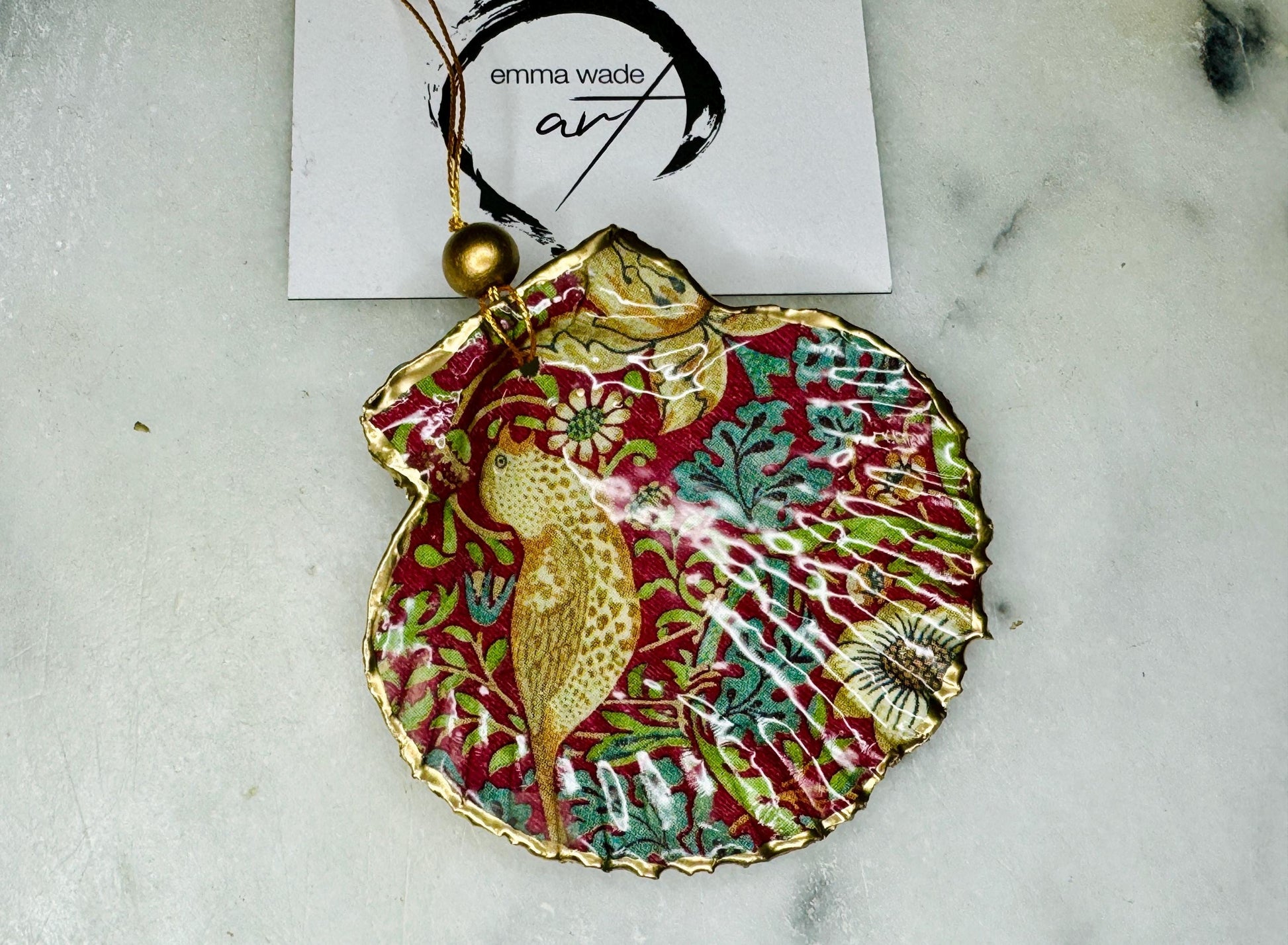 William Morris Strawberry Thief scallop shell ornaments, handmade Dorset scallop shell hanging decorations, gold leaf gilded flat shell ornaments, coastal Christmas tree decorations, Strawberry Thief William Morris nature inspired shell art, oyster and scallop shell hanging gifts, eco friendly handmade scallop shell decor UK, unique William Morris scallop ornaments for weddings, anniversaries, or new home, handmade Dorset scallop shell ornaments with gold string and gift box packaging