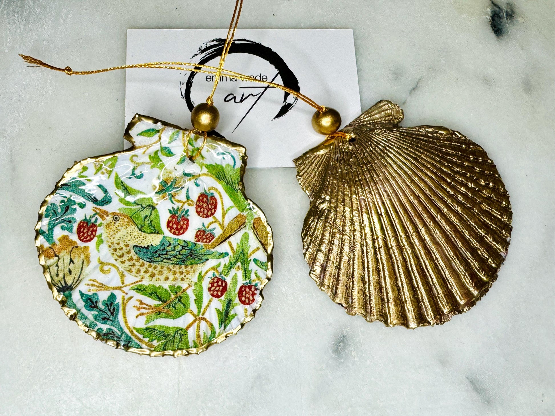 William Morris Strawberry Thief scallop shell ornaments, handmade Dorset scallop shell hanging decorations, gold leaf gilded flat shell ornaments, coastal Christmas tree decorations, Strawberry Thief William Morris nature inspired shell art, oyster and scallop shell hanging gifts, eco friendly handmade scallop shell decor UK, unique William Morris scallop ornaments for weddings, anniversaries, or new home, handmade Dorset scallop shell ornaments with gold string and gift box packaging
