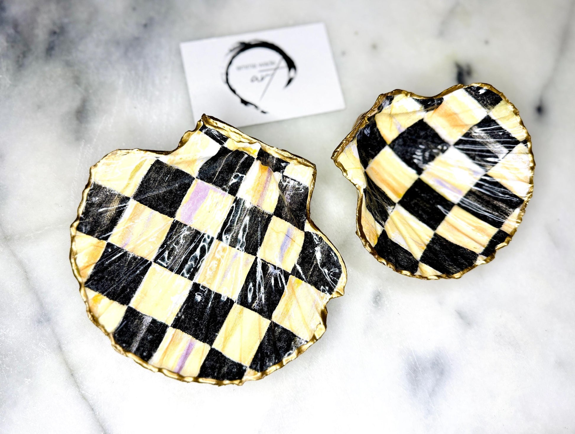 black and gold chequers scallop shell dish, handmade Dorset scallop shell trinket dish, gold leaf gilded jewellery holder, unique scallop shell ornament, black and gold coastal home decor, artisan scallop shell jewellery tray, scallop shell salt and pepper pinch pot, sustainable Dorset scallop shell gift, handmade scallop shell vanity dish UK, gothic scallop shell ornament gift, coastal inspired handmade shell decor, unique black and gold scallop shell keepsake, artisan shell jewellery dish UK