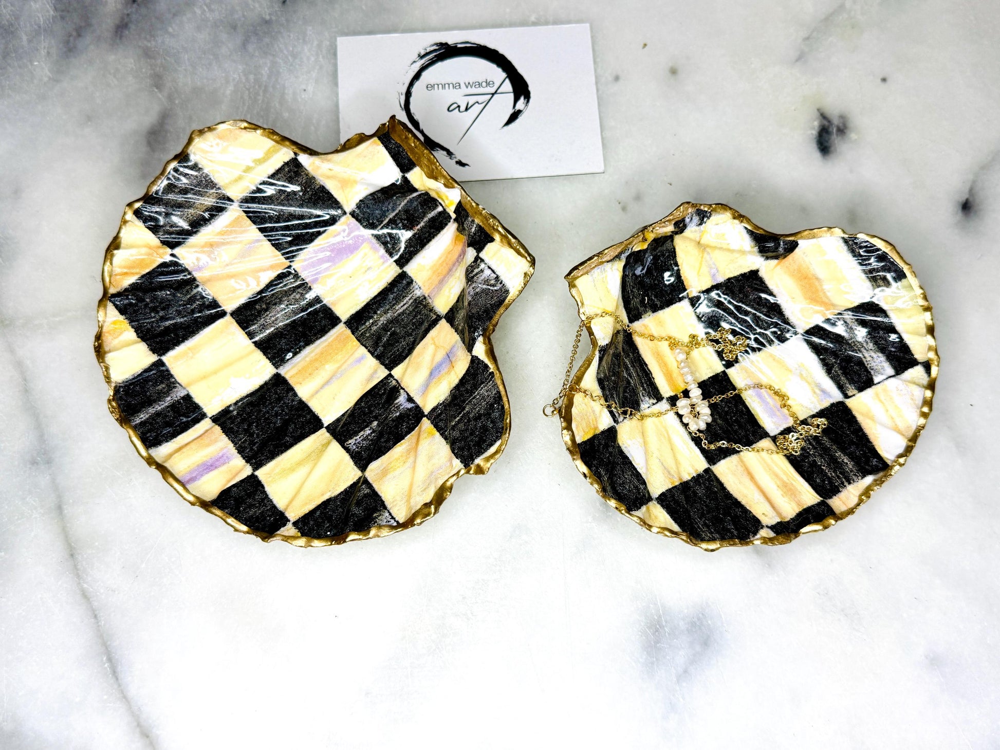 black and gold chequers scallop shell dish, handmade Dorset scallop shell trinket dish, gold leaf gilded jewellery holder, unique scallop shell ornament, black and gold coastal home decor, artisan scallop shell jewellery tray, scallop shell salt and pepper pinch pot, sustainable Dorset scallop shell gift, handmade scallop shell vanity dish UK, gothic scallop shell ornament gift, coastal inspired handmade shell decor, unique black and gold scallop shell keepsake, artisan shell jewellery dish UK