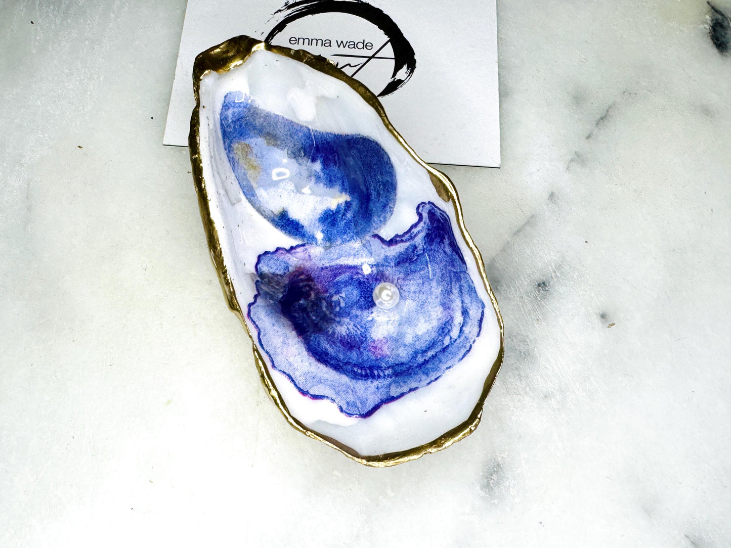Handmade Dorset oyster shell trinket dish with printed watercolour oyster design and Swarovski pearl, hand gilded with real gold leaf and finished in glossy resin. Sustainable oyster shell jewellery dish, ring holder, or keepsake tray. Perfect handmade UK gift for ocean lovers, coastal décor accessory, or unique wedding favour. Ideal as a jewellery storage dish, bathroom ornament, or decorative oyster shell art piece.