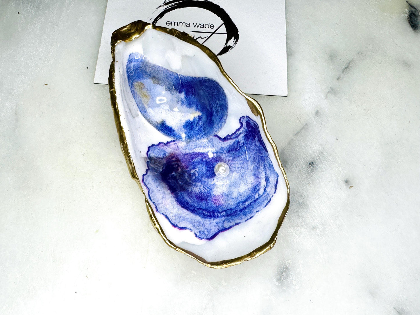 Handmade Dorset oyster shell trinket dish with printed watercolour oyster design and Swarovski pearl, hand gilded with real gold leaf and finished in glossy resin. Sustainable oyster shell jewellery dish, ring holder, or keepsake tray. Perfect handmade UK gift for ocean lovers, coastal décor accessory, or unique wedding favour. Ideal as a jewellery storage dish, bathroom ornament, or decorative oyster shell art piece.