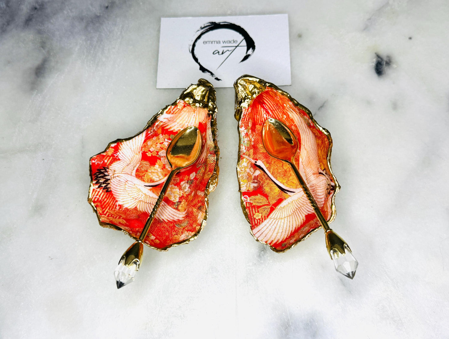 Handmade oyster shell cruet set with gold leaf trim. Salt and pepper pinch pots made from Dorset shells. Orange flamingo and Japanese kimono bird design. Sustainable and eco-friendly. A unique salt gift for weddings, anniversaries, housewarmings, or as a Christmas gift. Perfect for dinner parties, coastal home decor, or handmade UK tableware. Also ideal as spice pots, shell pots, or luxury gifts with optional gold crystal spoons.