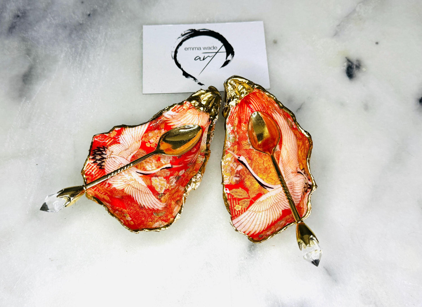 Handmade oyster shell cruet set with gold leaf trim. Salt and pepper pinch pots made from Dorset shells. Orange flamingo and Japanese kimono bird design. Sustainable and eco-friendly. A unique salt gift for weddings, anniversaries, housewarmings, or as a Christmas gift. Perfect for dinner parties, coastal home decor, or handmade UK tableware. Also ideal as spice pots, shell pots, or luxury gifts with optional gold crystal spoons.