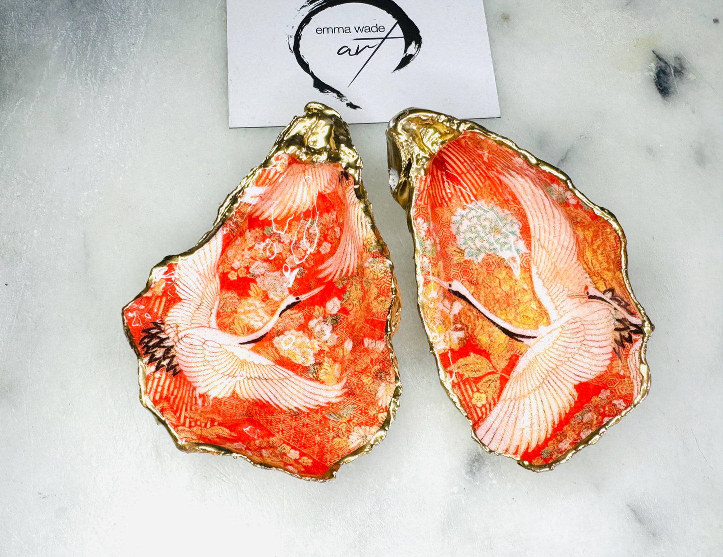 Handmade oyster shell cruet set with gold leaf trim. Salt and pepper pinch pots made from Dorset shells. Orange flamingo and Japanese kimono bird design. Sustainable and eco-friendly. A unique salt gift for weddings, anniversaries, housewarmings, or as a Christmas gift. Perfect for dinner parties, coastal home decor, or handmade UK tableware. Also ideal as spice pots, shell pots, or luxury gifts with optional gold crystal spoons.