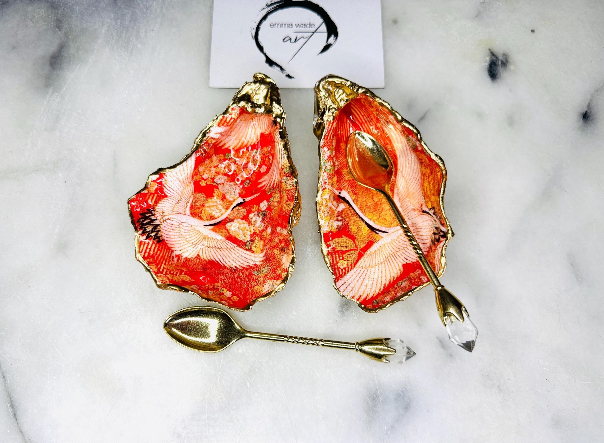 Handmade oyster shell cruet set with gold leaf trim. Salt and pepper pinch pots made from Dorset shells. Orange flamingo and Japanese kimono bird design. Sustainable and eco-friendly. A unique salt gift for weddings, anniversaries, housewarmings, or as a Christmas gift. Perfect for dinner parties, coastal home decor, or handmade UK tableware. Also ideal as spice pots, shell pots, or luxury gifts with optional gold crystal spoons.