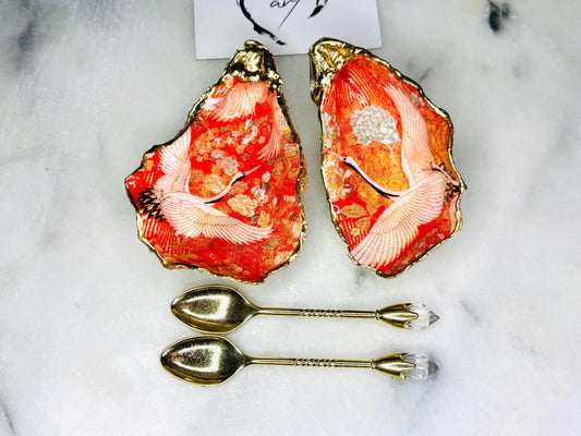 Handmade oyster shell cruet set with gold leaf trim. Salt and pepper pinch pots made from Dorset shells. Orange flamingo and Japanese kimono bird design. Sustainable and eco-friendly. A unique salt gift for weddings, anniversaries, housewarmings, or as a Christmas gift. Perfect for dinner parties, coastal home decor, or handmade UK tableware. Also ideal as spice pots, shell pots, or luxury gifts with optional gold crystal spoons.
