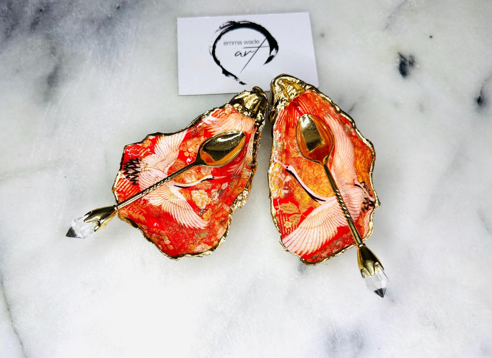 Handmade oyster shell cruet set with gold leaf trim. Salt and pepper pinch pots made from Dorset shells. Orange flamingo and Japanese kimono bird design. Sustainable and eco-friendly. A unique salt gift for weddings, anniversaries, housewarmings, or as a Christmas gift. Perfect for dinner parties, coastal home decor, or handmade UK tableware. Also ideal as spice pots, shell pots, or luxury gifts with optional gold crystal spoons.
