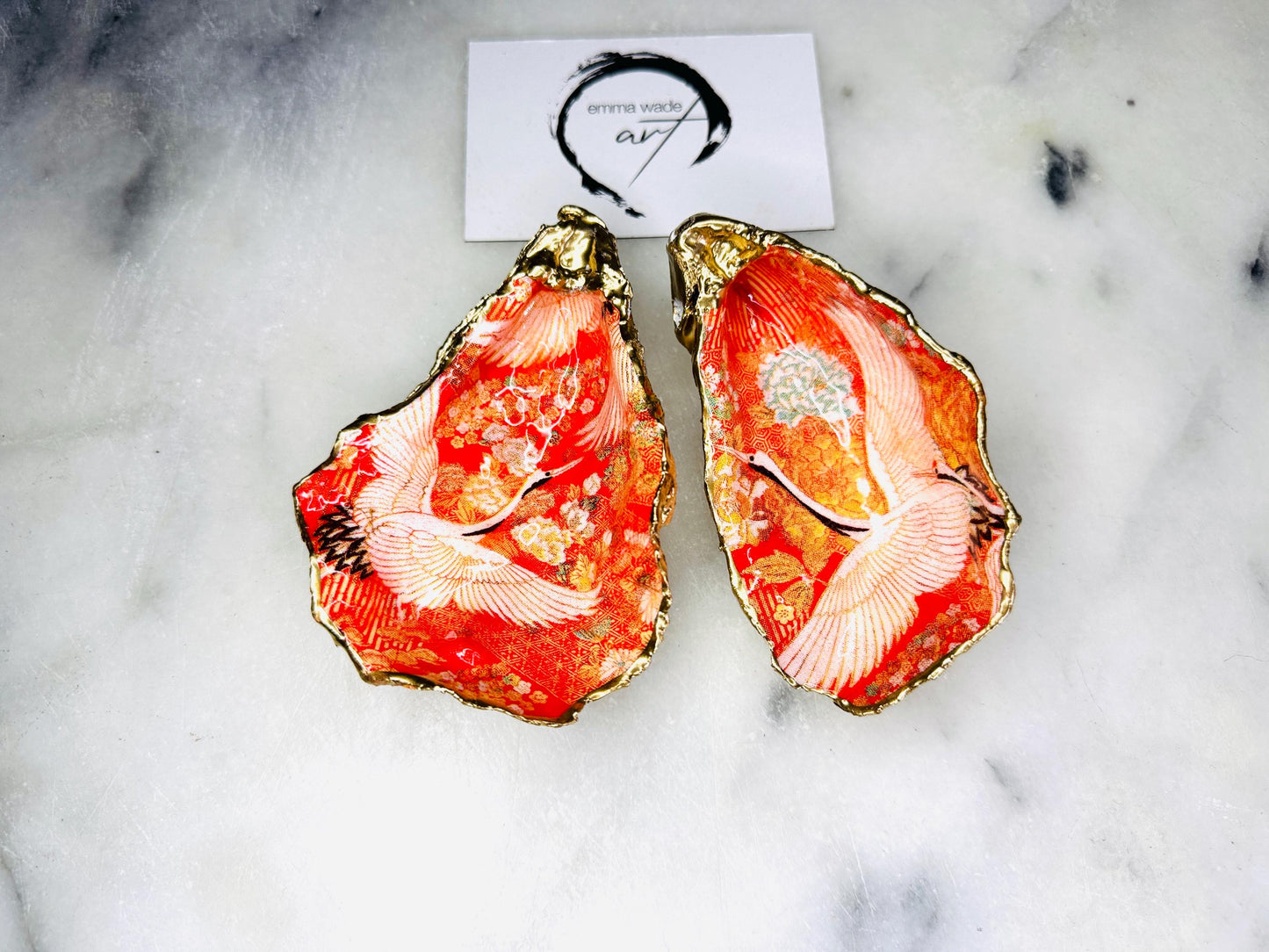 Handmade oyster shell cruet set with gold leaf trim. Salt and pepper pinch pots made from Dorset shells. Orange flamingo and Japanese kimono bird design. Sustainable and eco-friendly. A unique salt gift for weddings, anniversaries, housewarmings, or as a Christmas gift. Perfect for dinner parties, coastal home decor, or handmade UK tableware. Also ideal as spice pots, shell pots, or luxury gifts with optional gold crystal spoons.
