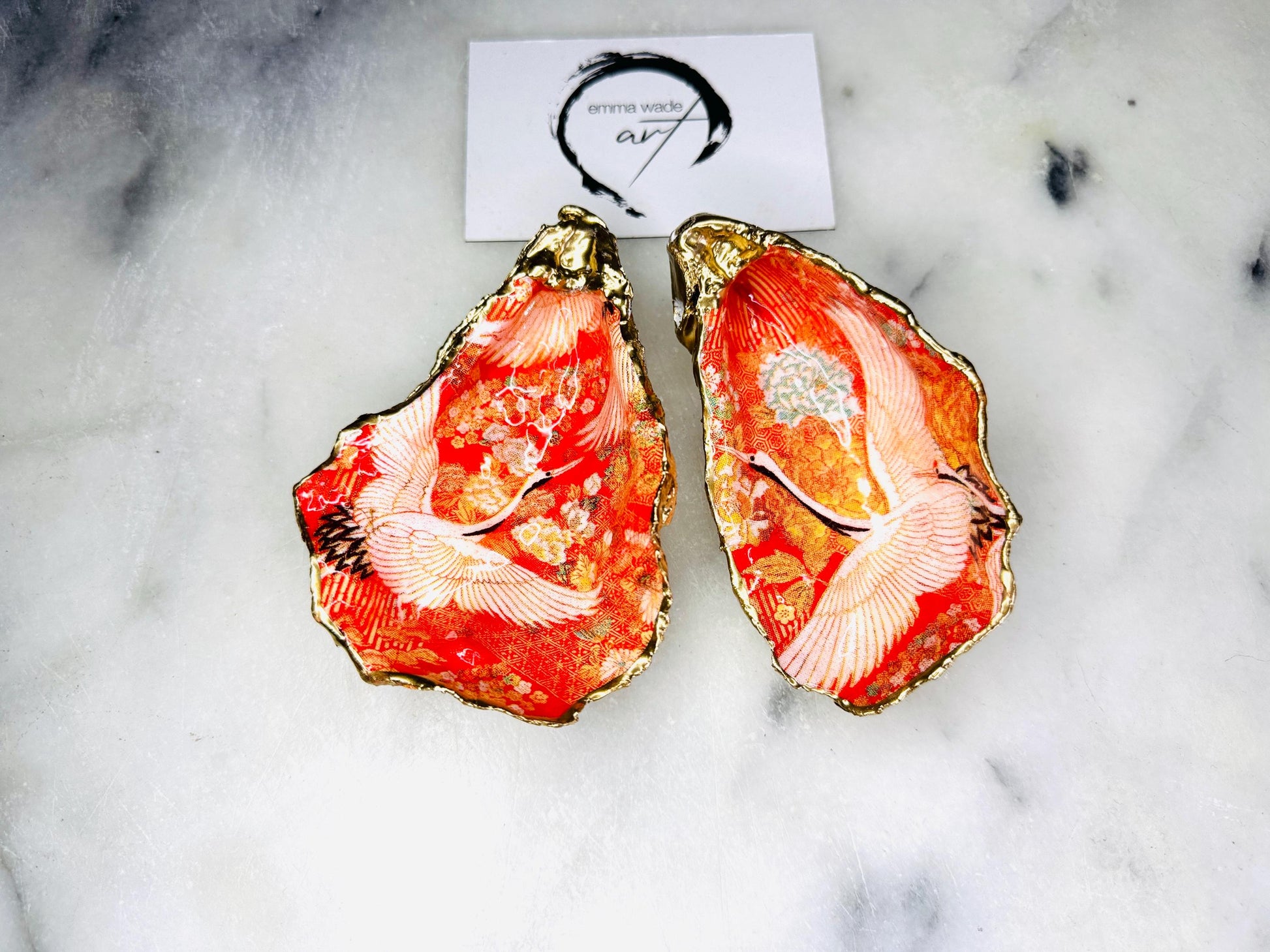 Handmade oyster shell cruet set with gold leaf trim. Salt and pepper pinch pots made from Dorset shells. Orange flamingo and Japanese kimono bird design. Sustainable and eco-friendly. A unique salt gift for weddings, anniversaries, housewarmings, or as a Christmas gift. Perfect for dinner parties, coastal home decor, or handmade UK tableware. Also ideal as spice pots, shell pots, or luxury gifts with optional gold crystal spoons.
