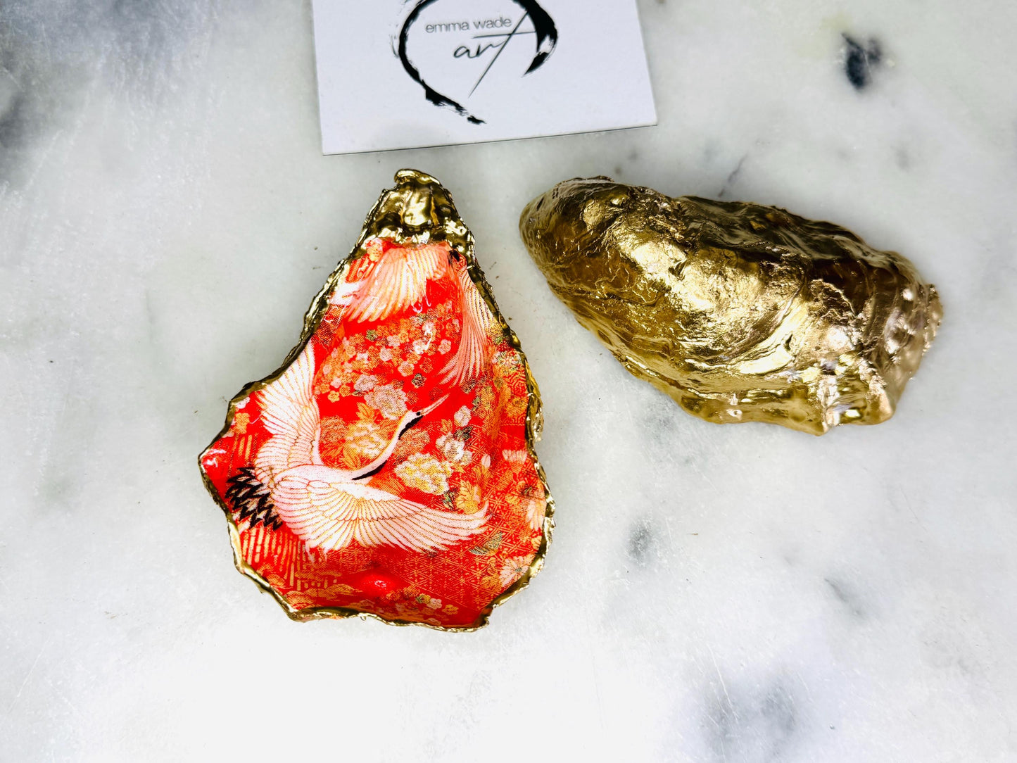Handmade oyster shell cruet set with gold leaf trim. Salt and pepper pinch pots made from Dorset shells. Orange flamingo and Japanese kimono bird design. Sustainable and eco-friendly. A unique salt gift for weddings, anniversaries, housewarmings, or as a Christmas gift. Perfect for dinner parties, coastal home decor, or handmade UK tableware. Also ideal as spice pots, shell pots, or luxury gifts with optional gold crystal spoons.