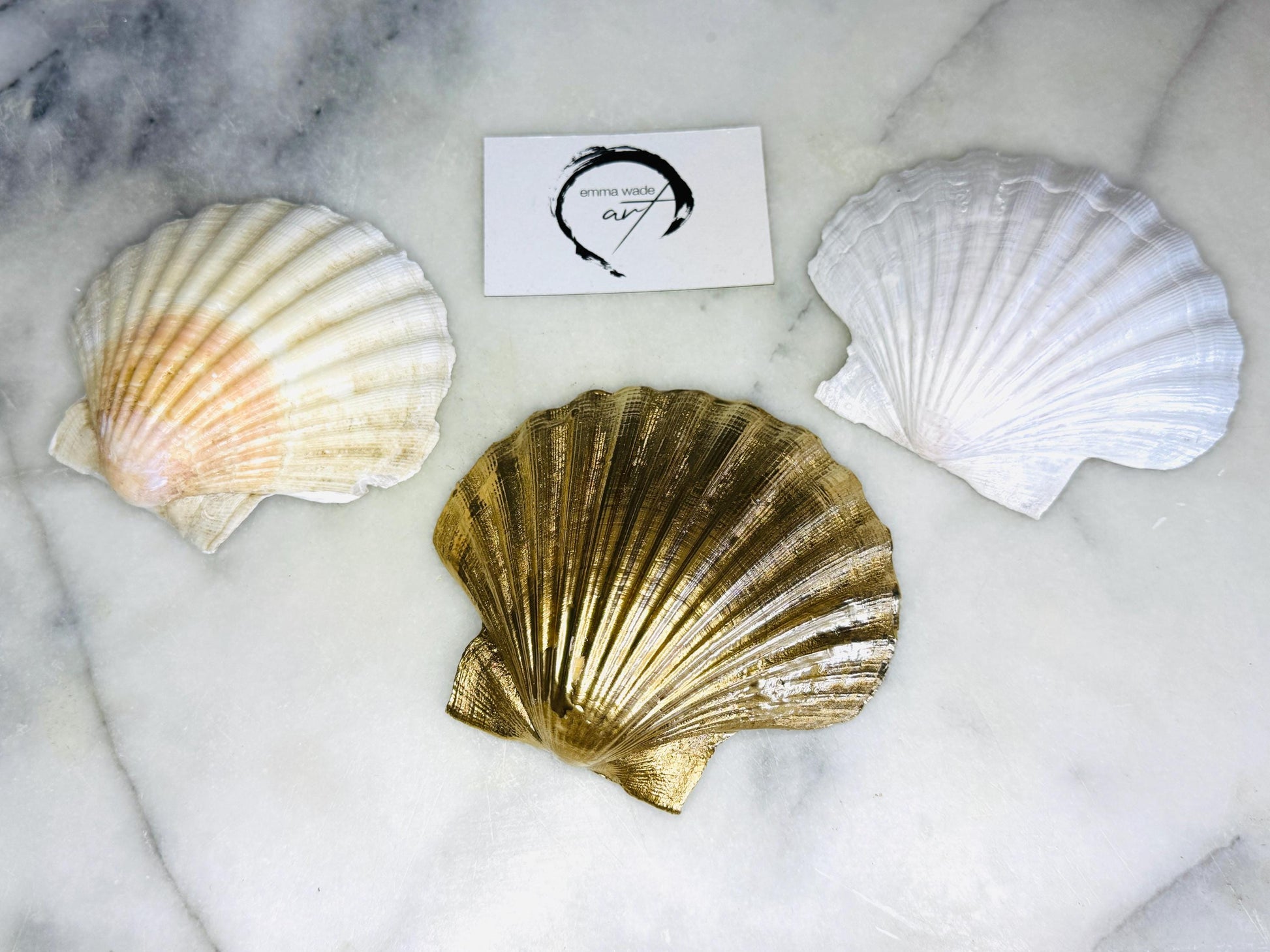 Handmade scallop shell trinket dish featuring a blue sea turtle illustration, finished with high gloss crystal resin and optional gilded gold leaf edges. Coastal home decor shell dish for jewellery, rings, trinkets or bedside storage. Nautical ocean inspired decorative shell, handmade in the UK using sustainably sourced shells from the Dorset coastline. Ideal coastal gift for ocean lovers and beach house interiors. various  finishes to the reverse of the shells available