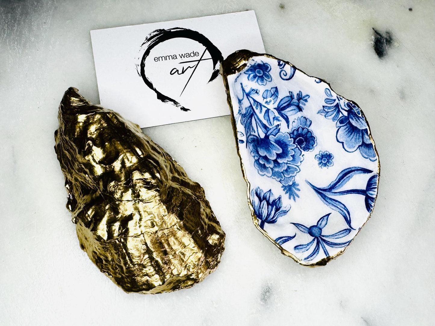 Delft blue floral oyster shell dish, handmade Dorset oyster shell trinket dish, gold leaf oyster shell jewellery holder, silver gilded oyster shell ornament, blue and white floral oyster shell decor, sustainable coastal oyster shell gift, artisan oyster shell jewellery tray UK, Delft blue oyster shell salt and pepper pinch pot, oyster shell spoon rest, handmade floral oyster shell vanity dish, Delft inspired coastal oyster shell ornament, unique oyster shell gift for wedding or anniversary