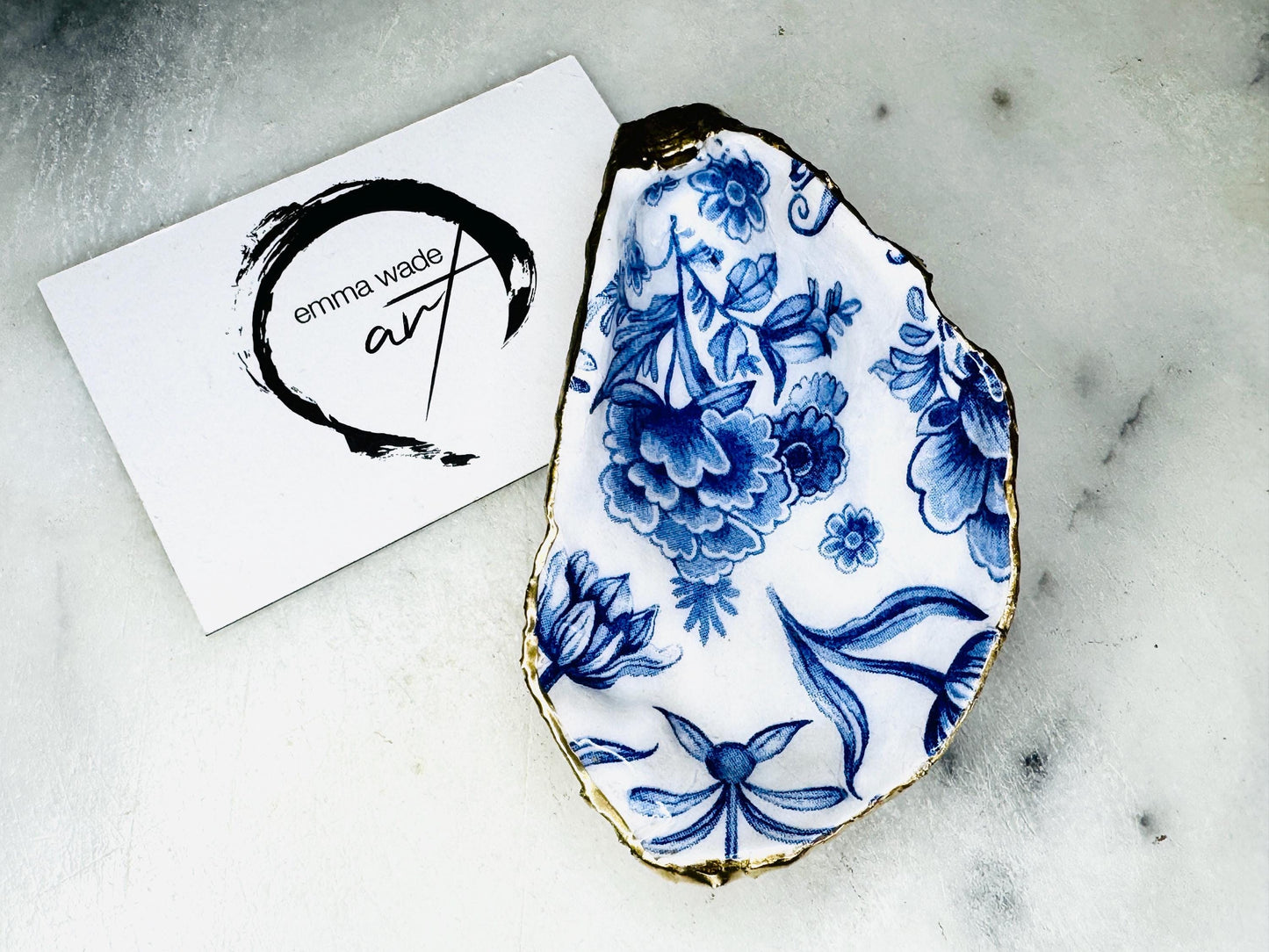 Delft blue floral oyster shell dish, handmade Dorset oyster shell trinket dish, gold leaf oyster shell jewellery holder, silver gilded oyster shell ornament, blue and white floral oyster shell decor, sustainable coastal oyster shell gift, artisan oyster shell jewellery tray UK, Delft blue oyster shell salt and pepper pinch pot, oyster shell spoon rest, handmade floral oyster shell vanity dish, Delft inspired coastal oyster shell ornament, unique oyster shell gift for wedding or anniversary