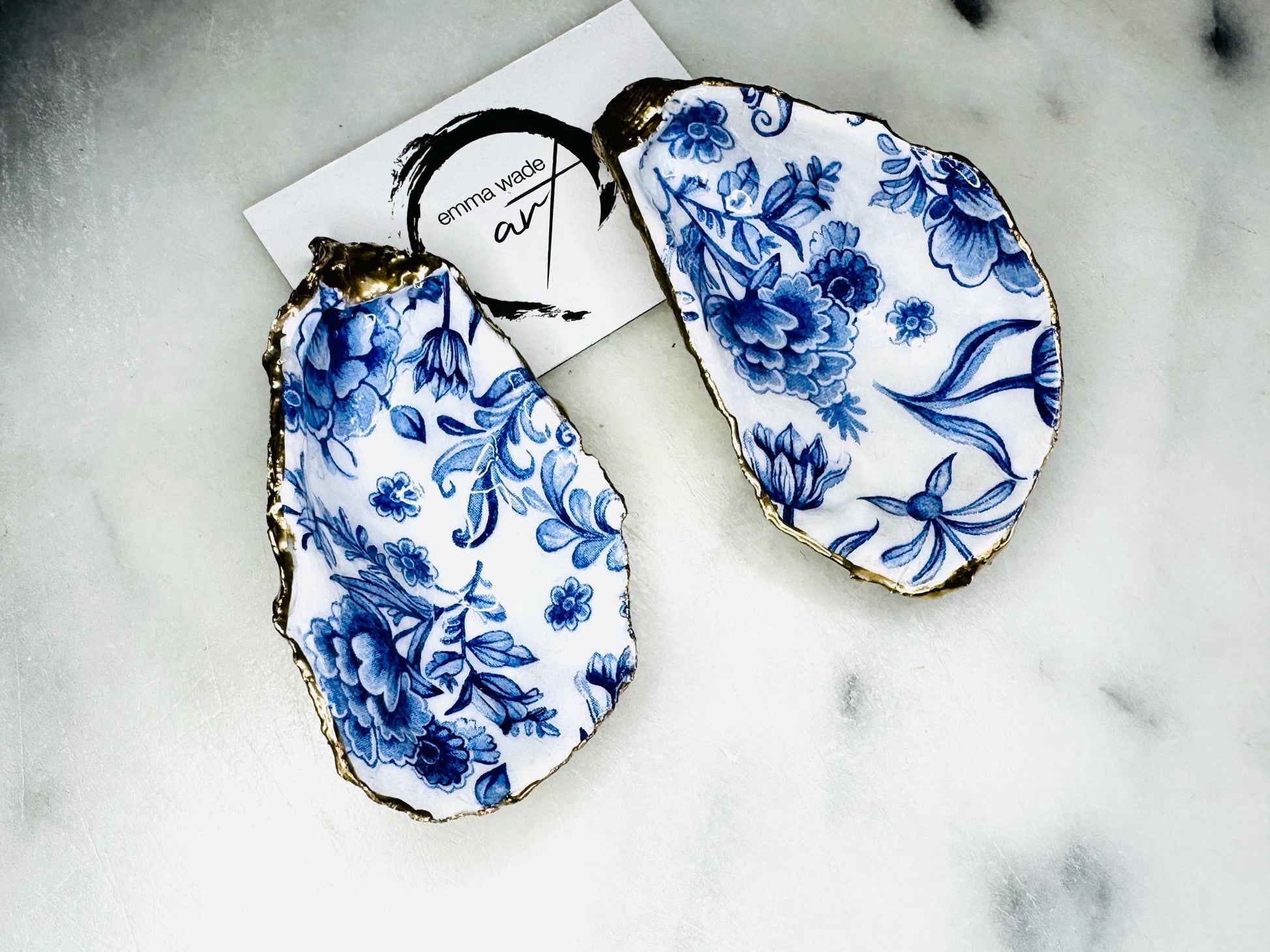 Delft blue floral oyster shell dish, handmade Dorset oyster shell trinket dish, gold leaf oyster shell jewellery holder, silver gilded oyster shell ornament, blue and white floral oyster shell decor, sustainable coastal oyster shell gift, artisan oyster shell jewellery tray UK, Delft blue oyster shell salt and pepper pinch pot, oyster shell spoon rest, handmade floral oyster shell vanity dish, Delft inspired coastal oyster shell ornament, unique oyster shell gift for wedding or anniversary