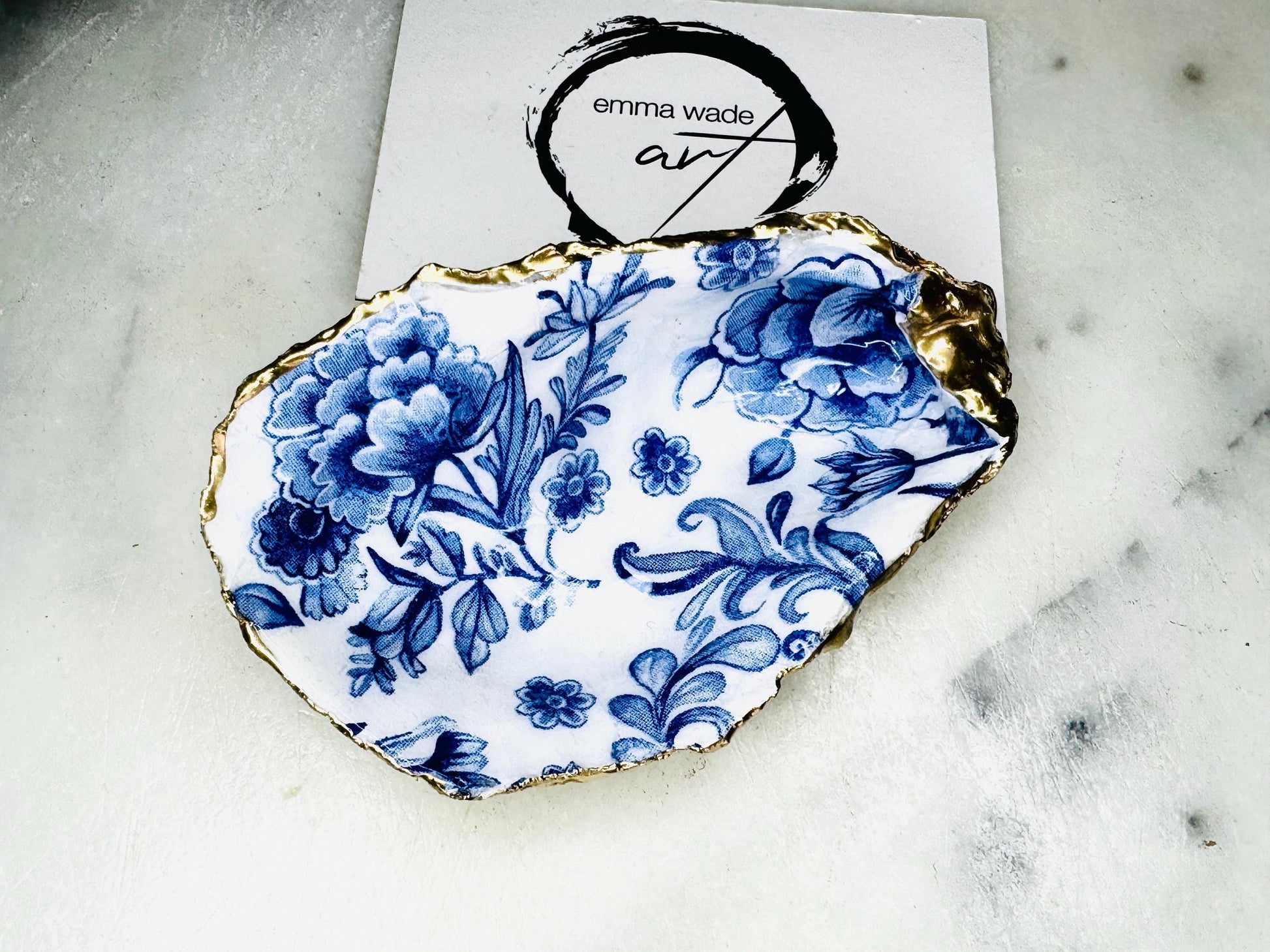 Delft blue floral oyster shell dish, handmade Dorset oyster shell trinket dish, gold leaf oyster shell jewellery holder, silver gilded oyster shell ornament, blue and white floral oyster shell decor, sustainable coastal oyster shell gift, artisan oyster shell jewellery tray UK, Delft blue oyster shell salt and pepper pinch pot, oyster shell spoon rest, handmade floral oyster shell vanity dish, Delft inspired coastal oyster shell ornament, unique oyster shell gift for wedding or anniversary