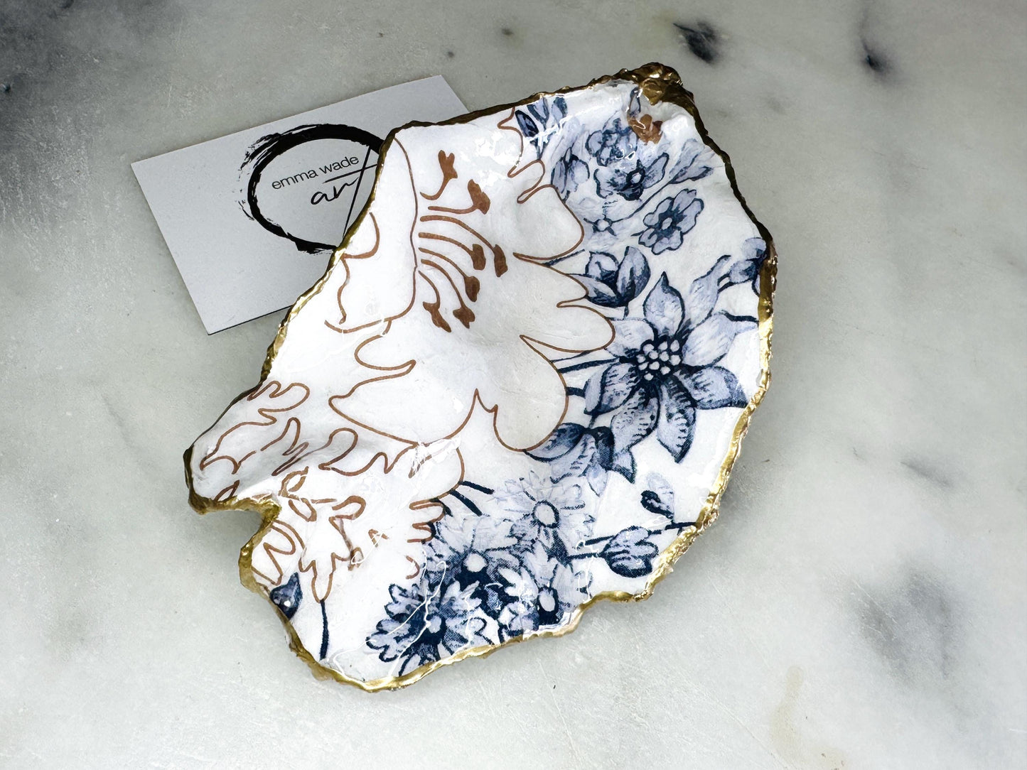 blue white Palmers print oyster shell dish, Dorset oyster shell trinket dish, gold leaf gilded oyster shell jewellery holder, handmade coastal oyster shell decor, sustainable oyster shell ornament, oyster shell bathroom tray, oyster shell salt and pepper pinch pot, oyster shell sugar dish, oyster shell spoon rest, floral oyster shell wedding gift, oyster shell Christmas present, eco friendly oyster shell art, oyster shell keepsake, unique handmade oyster shell gift UK