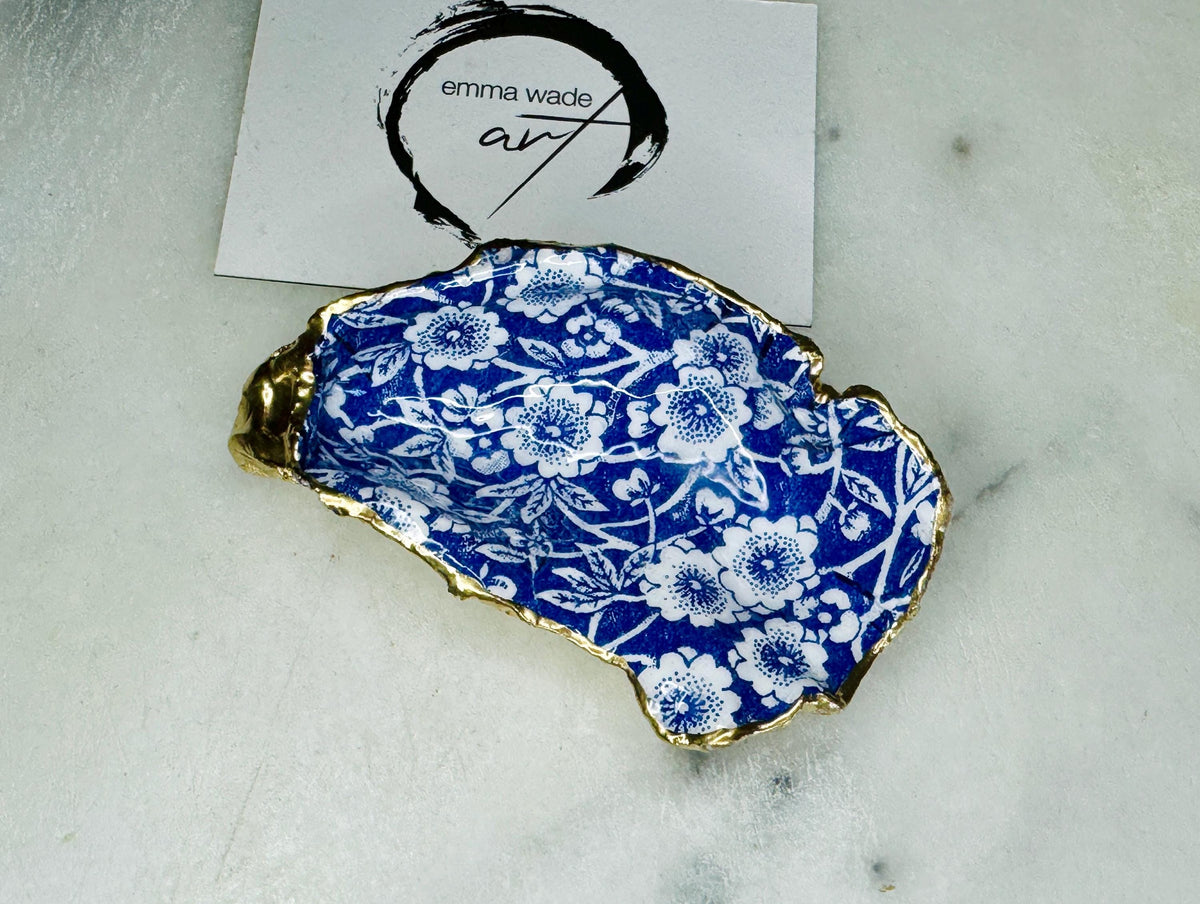 navy blue and white floral oyster shell dish, Dorset oyster shell jewellery holder, handmade coastal trinket dish UK, gold leaf gilded oyster shell ornament, eco friendly oyster shell vanity tray, unique handmade oyster shell cufflink or tie pin dish, navy floral oyster shell salt and pepper pinch pot, oyster shell spoon rest or sugar dish, floral oyster shell coastal bathroom accessory, sustainable Dorset oyster shell art, handmade oyster shell wedding or anniversary gift UK