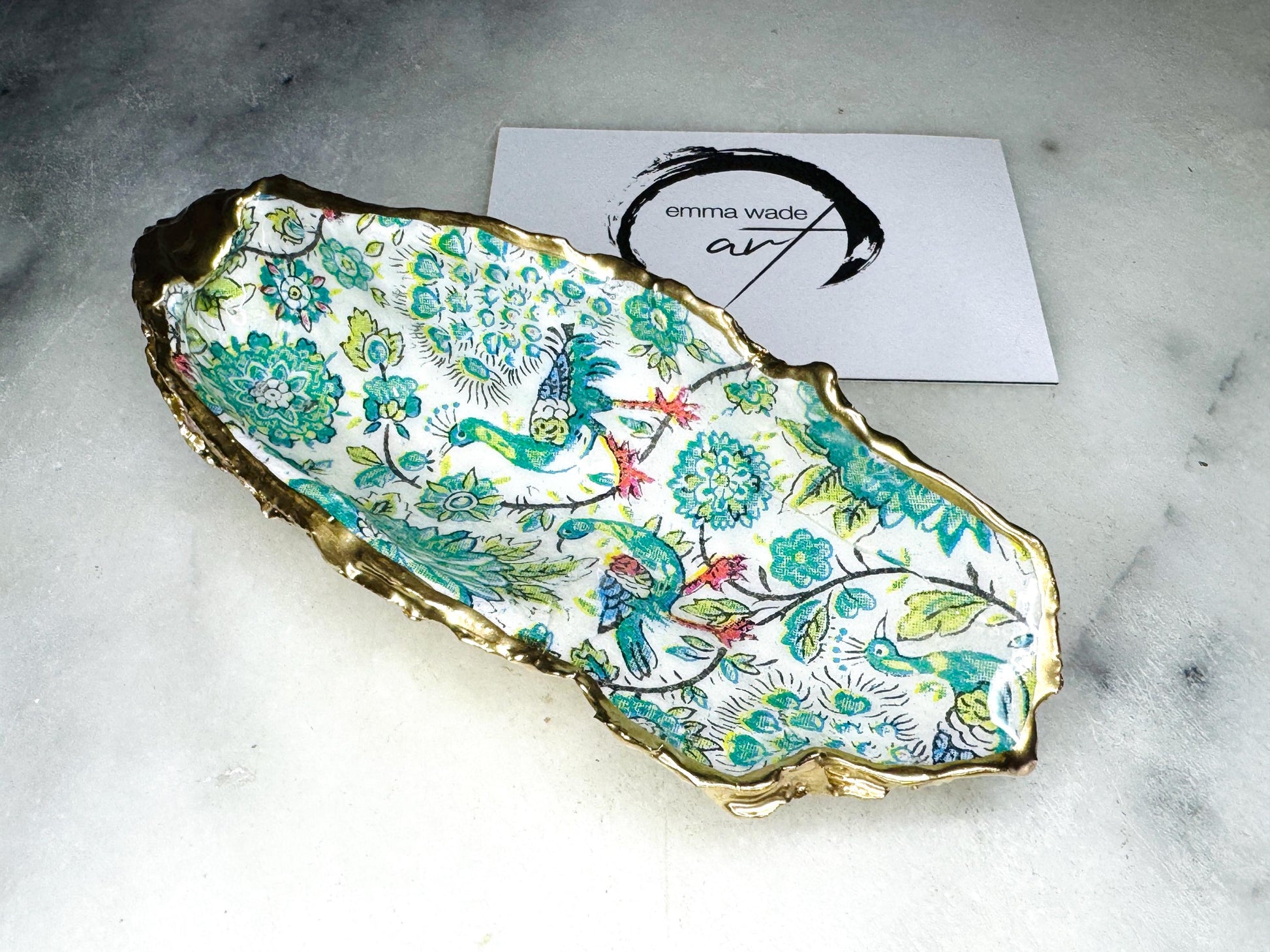 green peacock oyster shell dish, Dorset oyster shell jewellery holder, handmade peacock trinket dish, gold leaf gilded oyster shell ornament, eco friendly coastal oyster shell decor, peacock design oyster shell vanity tray, oyster shell salt and pepper pinch pot, peacock oyster shell cufflink and tie pin dish, green peacock oyster shell bathroom accessory, handmade Dorset oyster shell gift, unique peacock coastal home decor, sustainable oyster shell jewellery dish, artisan oyster art UK