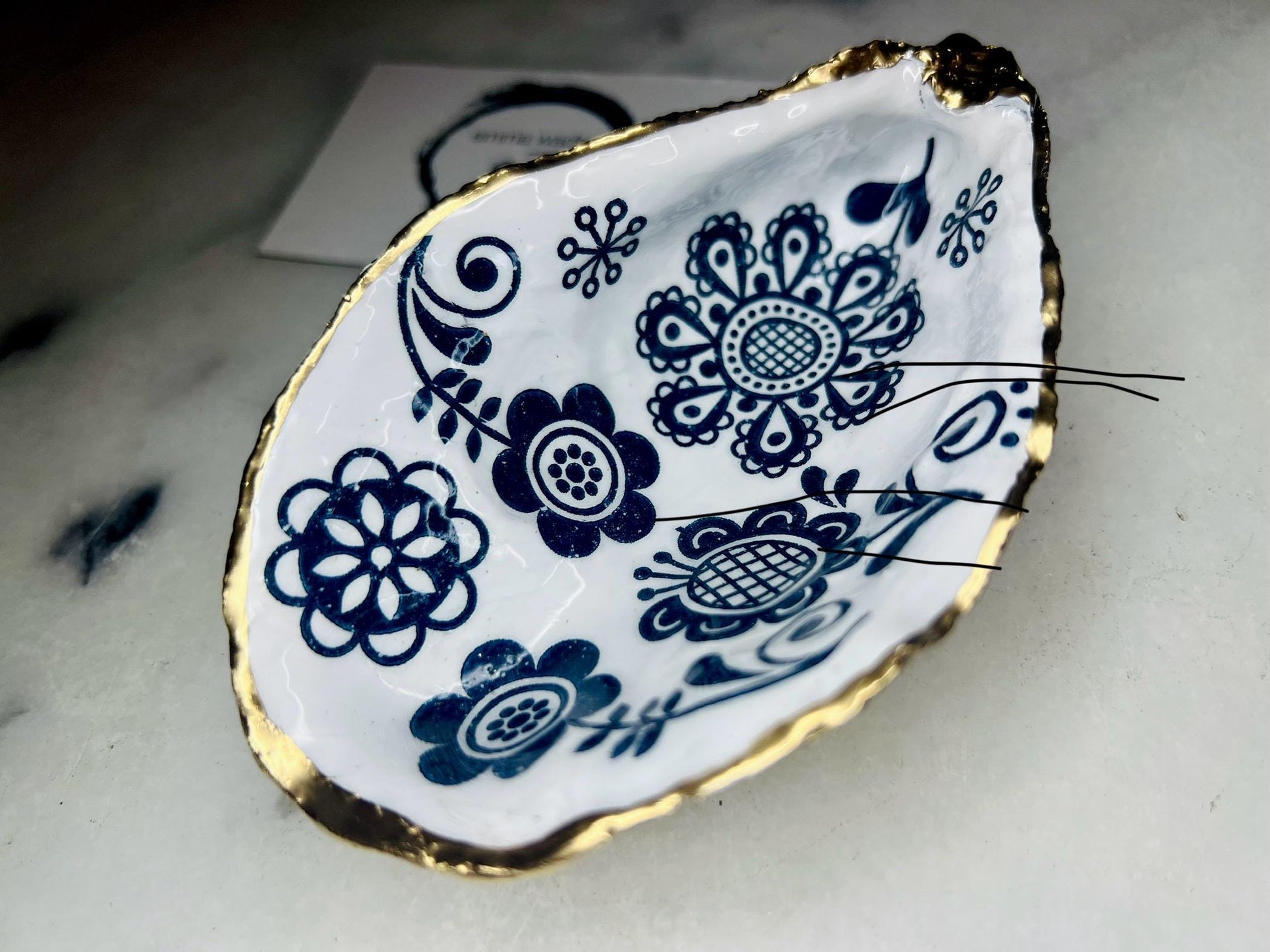 Marimekko flowers and birds oyster shell trinket dish, handmade coastal décor, Dorset shell jewellery holder, gold leaf gilded ornament, unique ocean-inspired gift, oyster shell ring dish, wedding favour, anniversary gift, handmade eco-friendly shell bowl, nautical bathroom accessory, salt and pepper pinch pot, tea light holder, sustainable oyster shell art, luxury coastal tableware, perfect gift for nature and design lovers.