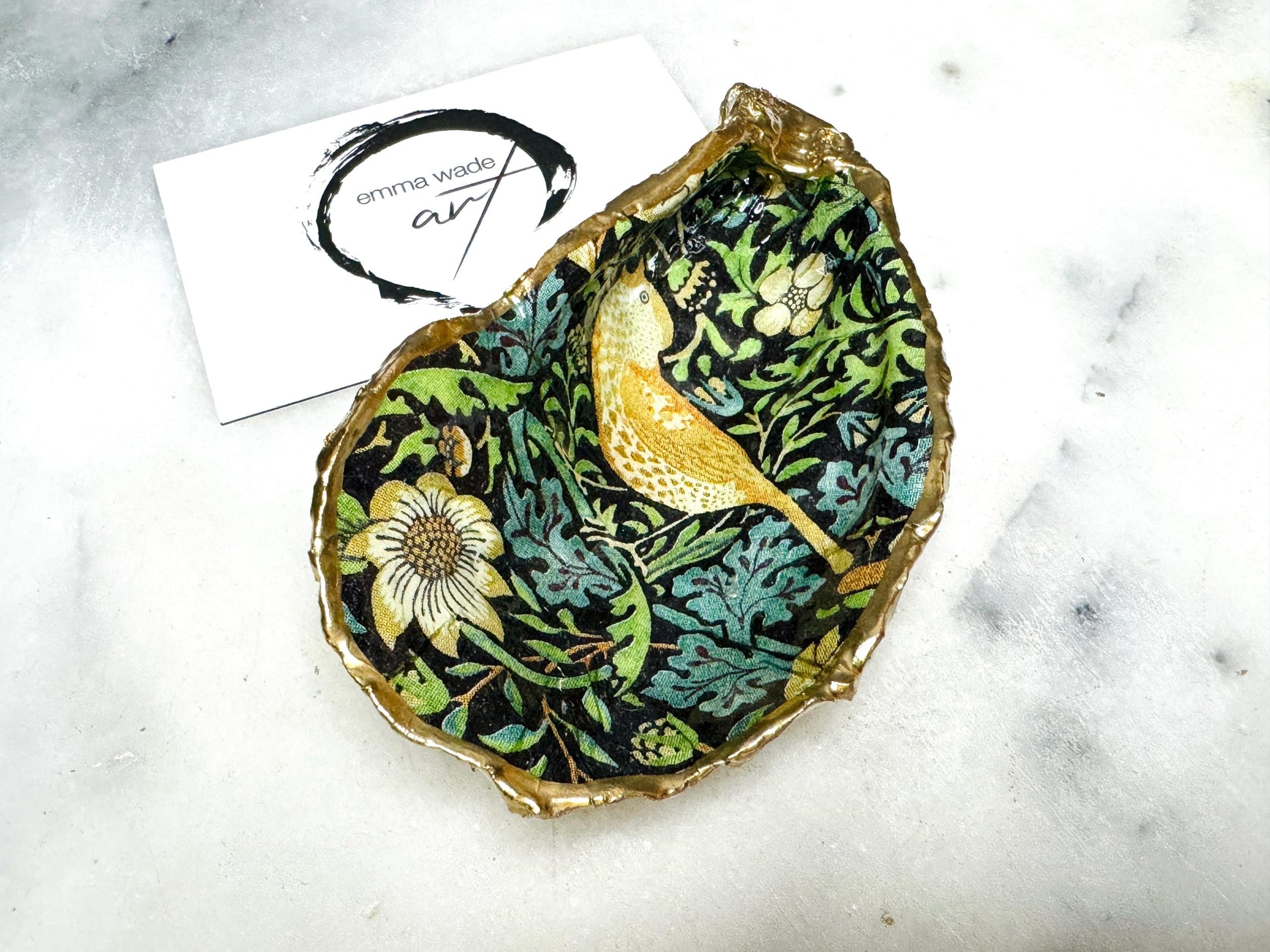 William Morris Strawberry Thief oyster shell dish, handmade in Dorset UK. Gold leaf gilded and resin sealed trinket dish. Two designs available. Use as jewellery holder, ring dish, spoon rest, or salt pinch pot. Unique coastal gift, eco-friendly oyster shell ornament, nature inspired home décor, wedding favour, anniversary present, handmade UK shell art.