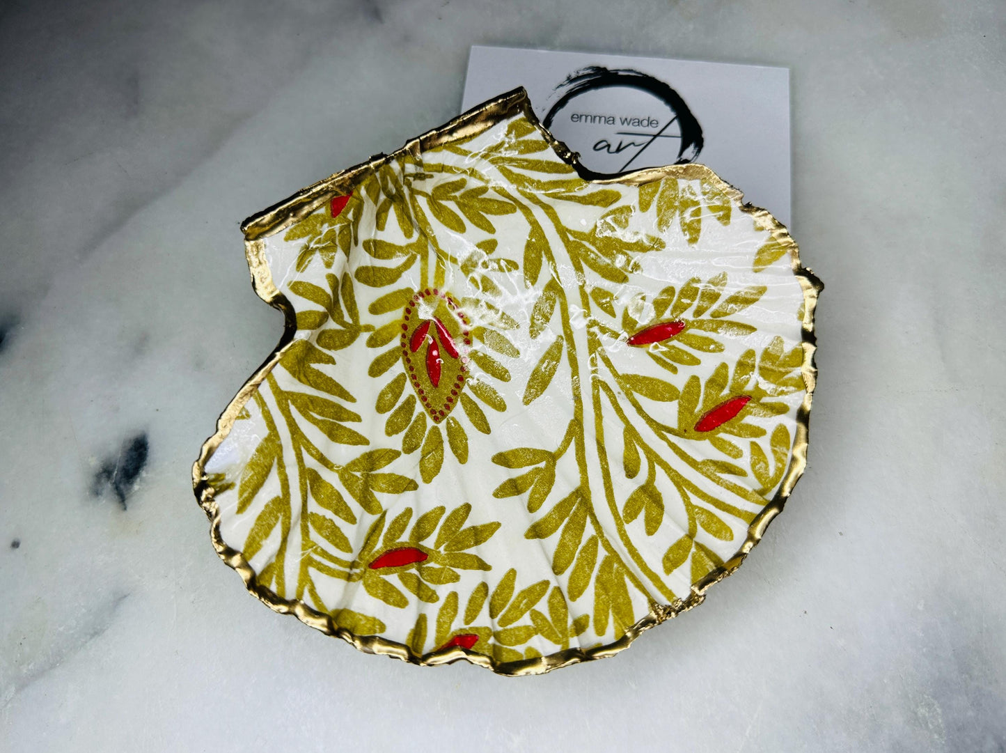 Handcrafted red and gold floral scallop shell trinket dish, gilded with liquid gold leaf and sealed in resin. Inspired by the Dorset coastline, this unique jewellery holder or trinket bowl is made from an authentic scallop shell and presented in a sustainable gift box. A thoughtful handmade coastal décor piece and ocean lover gift, ideal for weddings, birthdays, or elegant home styling.