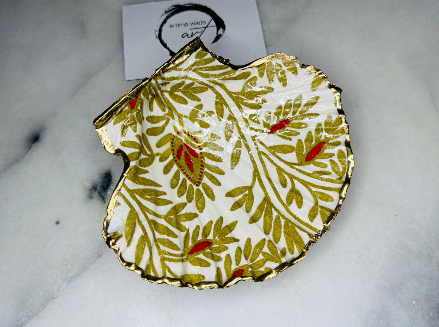 Elegant red and gold floral scallop shell trinket dish, hand-painted and gilded with liquid gold leaf before being sealed in crystal-clear resin. Each shell is a one-of-a-kind Dorset creation, perfect as a jewellery holder, tea light dish, or coastal home décor accent. A beautiful handmade ocean-inspired gift, presented in eco-friendly packaging and finished with sustainable care and artistry